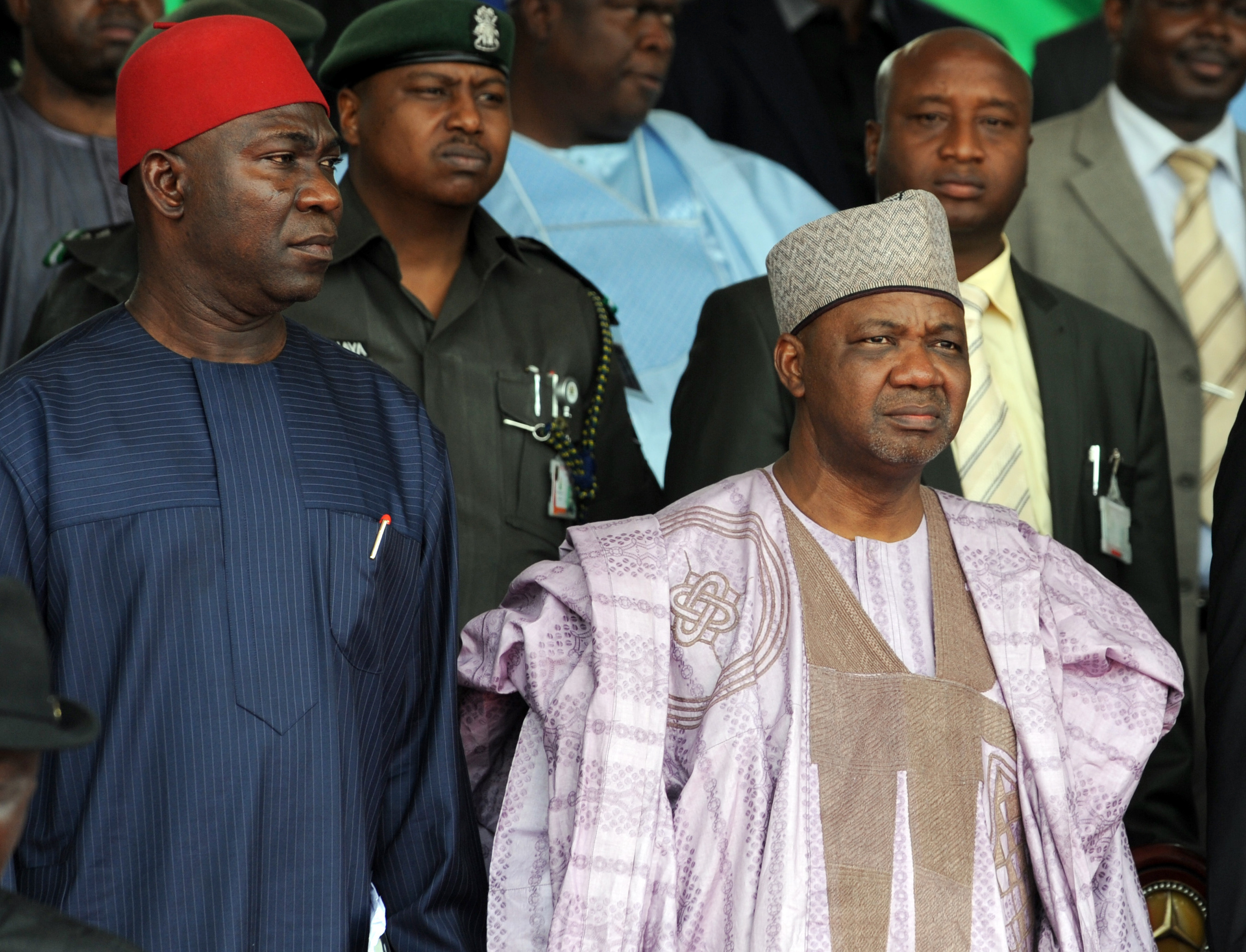 Nigeria's Vice President Namadi Sambo (R) and Deputy President of the Senate Ike Ekweremadu stand for the national anthem during the national inter-denominational funeral rites of Nigeria's secessionist leader Odumegwu Ojukwu at Michael Opkara Square in Enugu, southeastern Nigeria, on March 1, 2012. Soldiers fired a 21-gun salute at the funeral of Odumegwu Ojukwu on Thursday as Nigerian leaders paid final respects to the man whose 1967 declaration of Biafran independence sparked a civil war. For