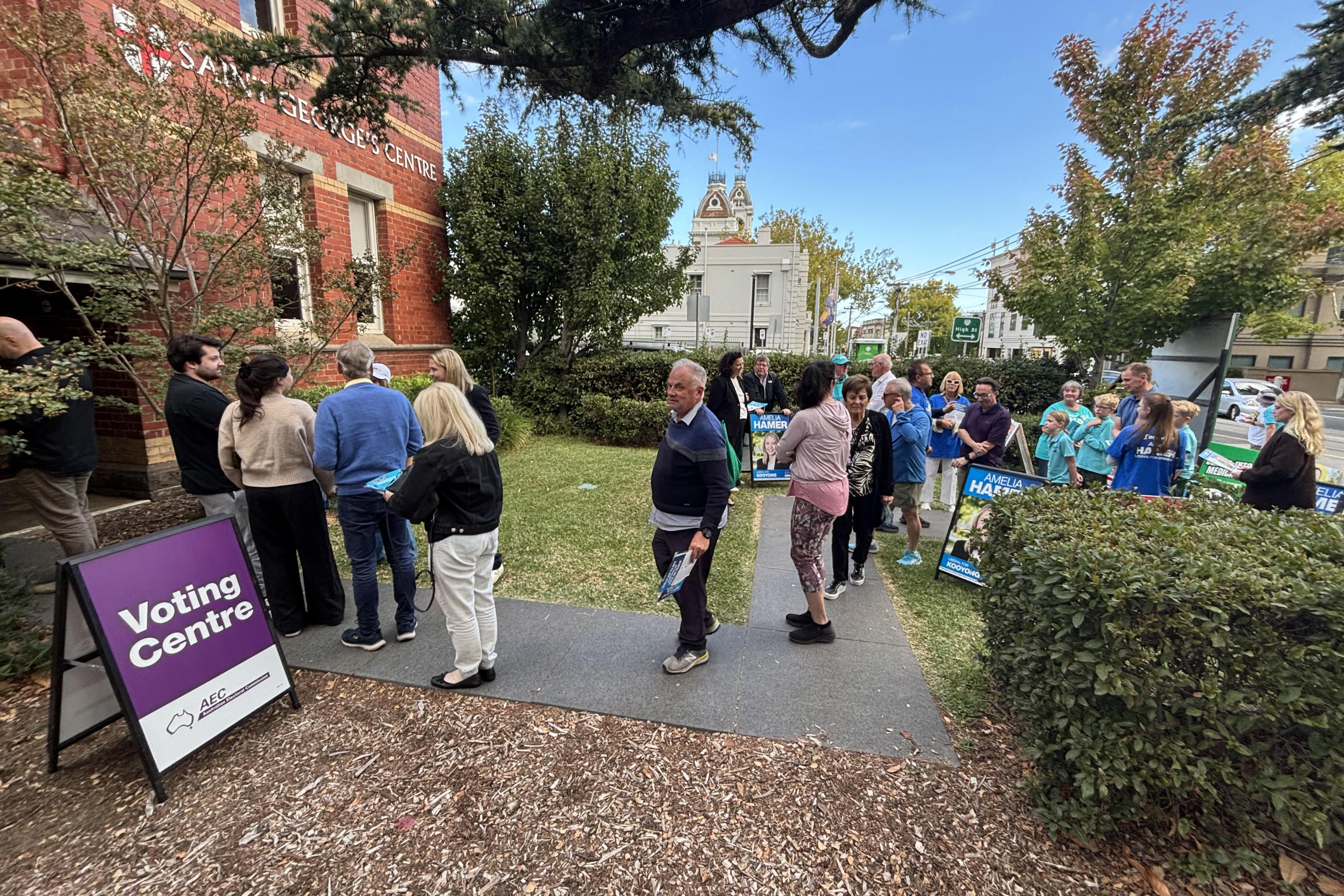 Queues form outside a Kooyong pre-polling centre today 