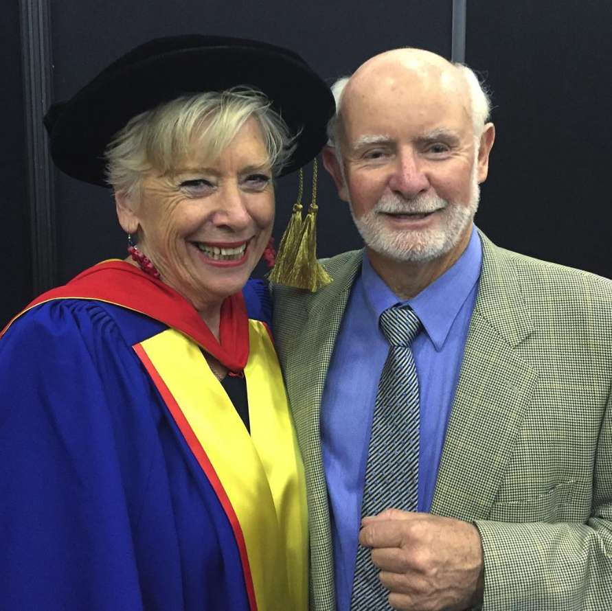 Maggie Beer with her husband Colin. Maggie is wearing university robes.