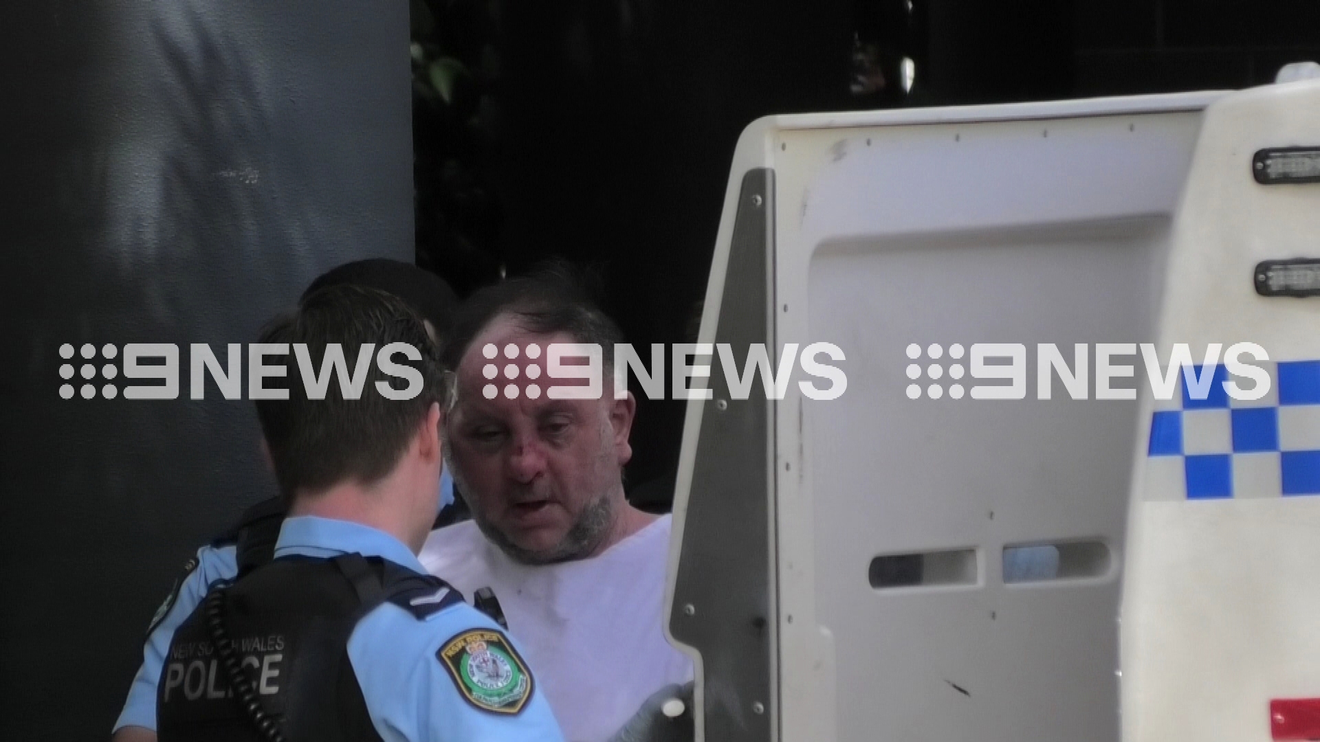 The 60-year-old father who randomly fired up to 50 shots from his unit window in Sydney's inner west has been captured leaving a hospital on his way to the police station, where he awaits charges. ﻿