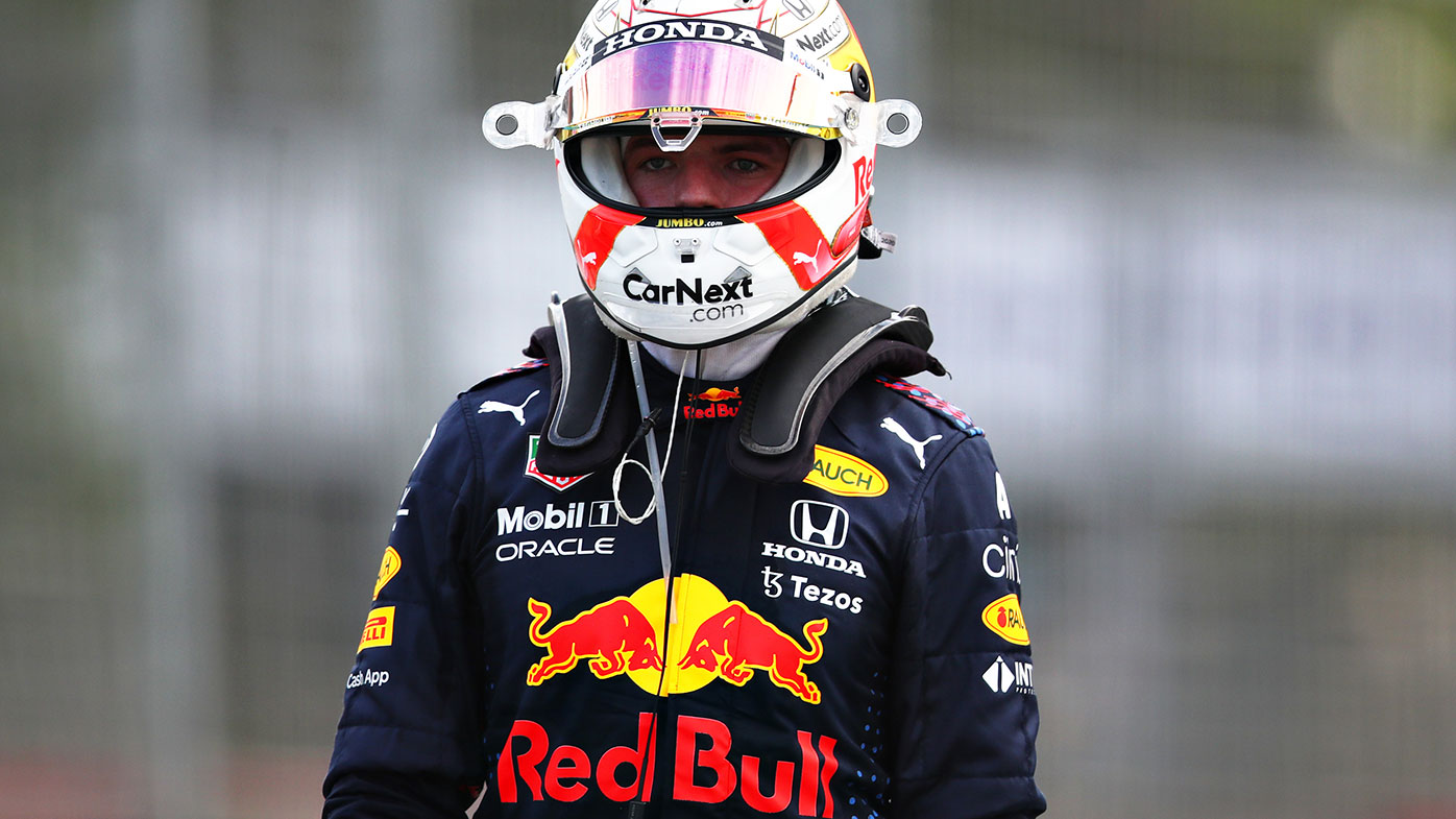 Max Verstappen walks back to the pits after retiring from the Azerbaijan Grand Prix.
