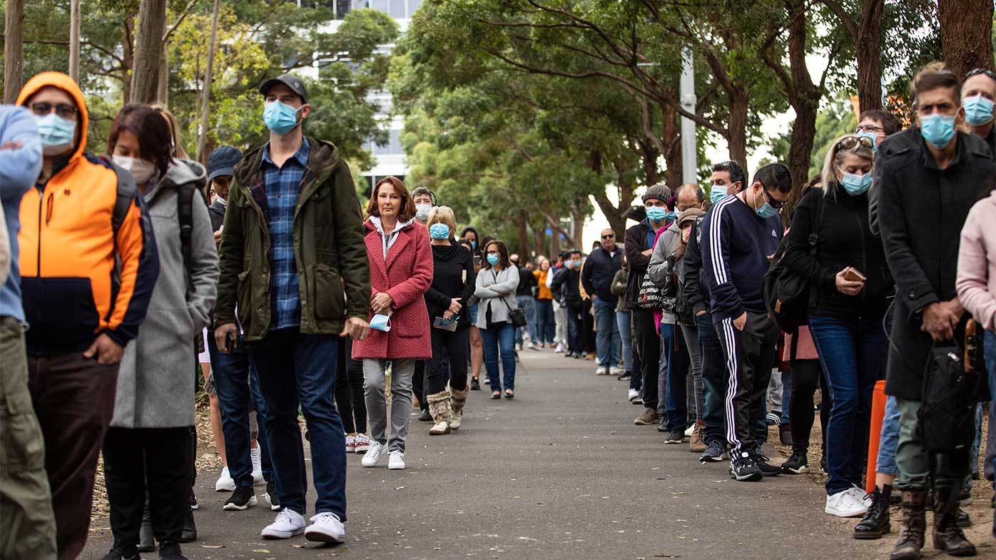 Hundreds line up to recieve a COVID-19 vaccination at the NSW Health Vaccinination Centre in Homebush.