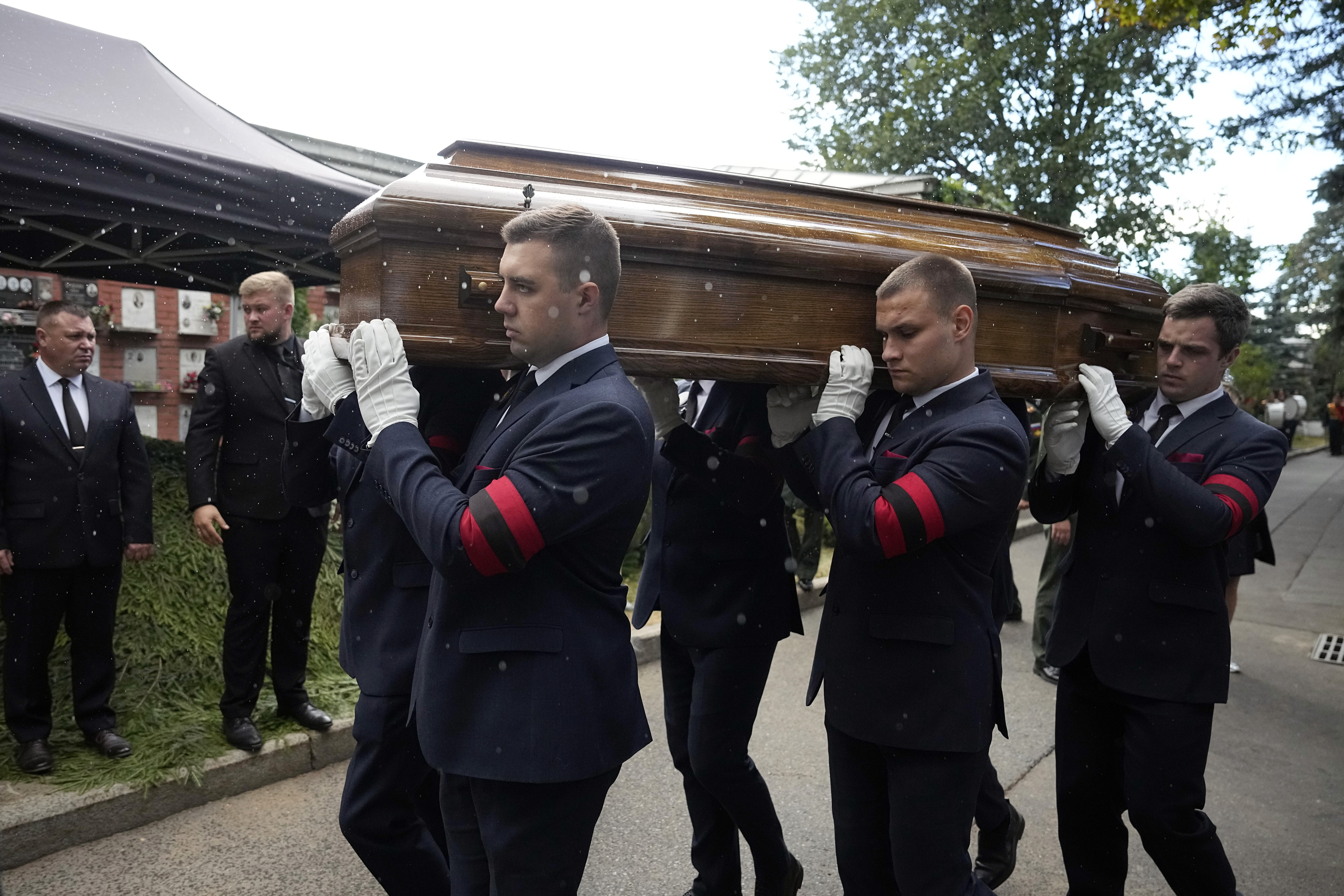 Memorial service personnel carry the coffin of former Soviet President Mikhail Gorbachev during his funeral at Novodevichy Cemetery in Moscow, Russia, Saturday, Sept. 3, 2022 