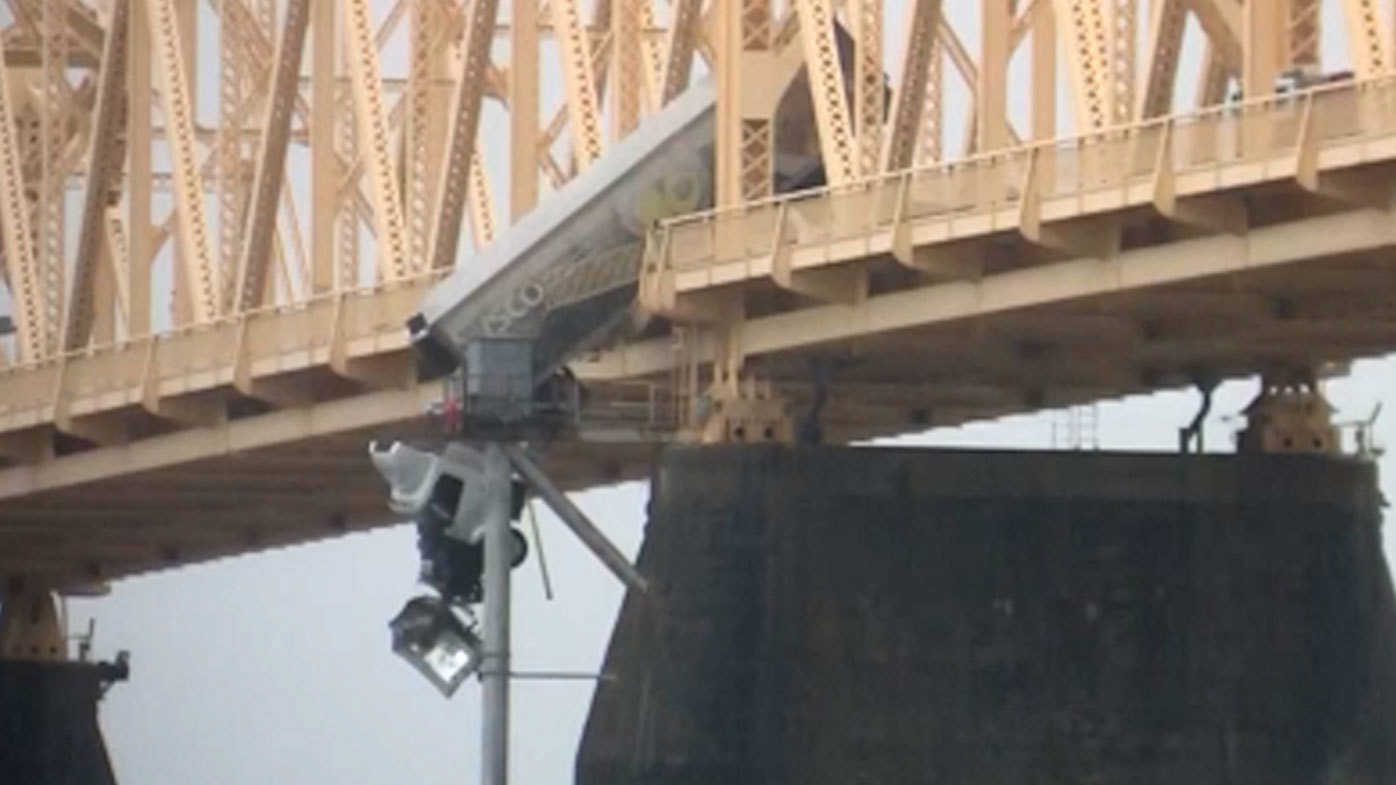 The driver was left dangling over the edge in the truck crash.