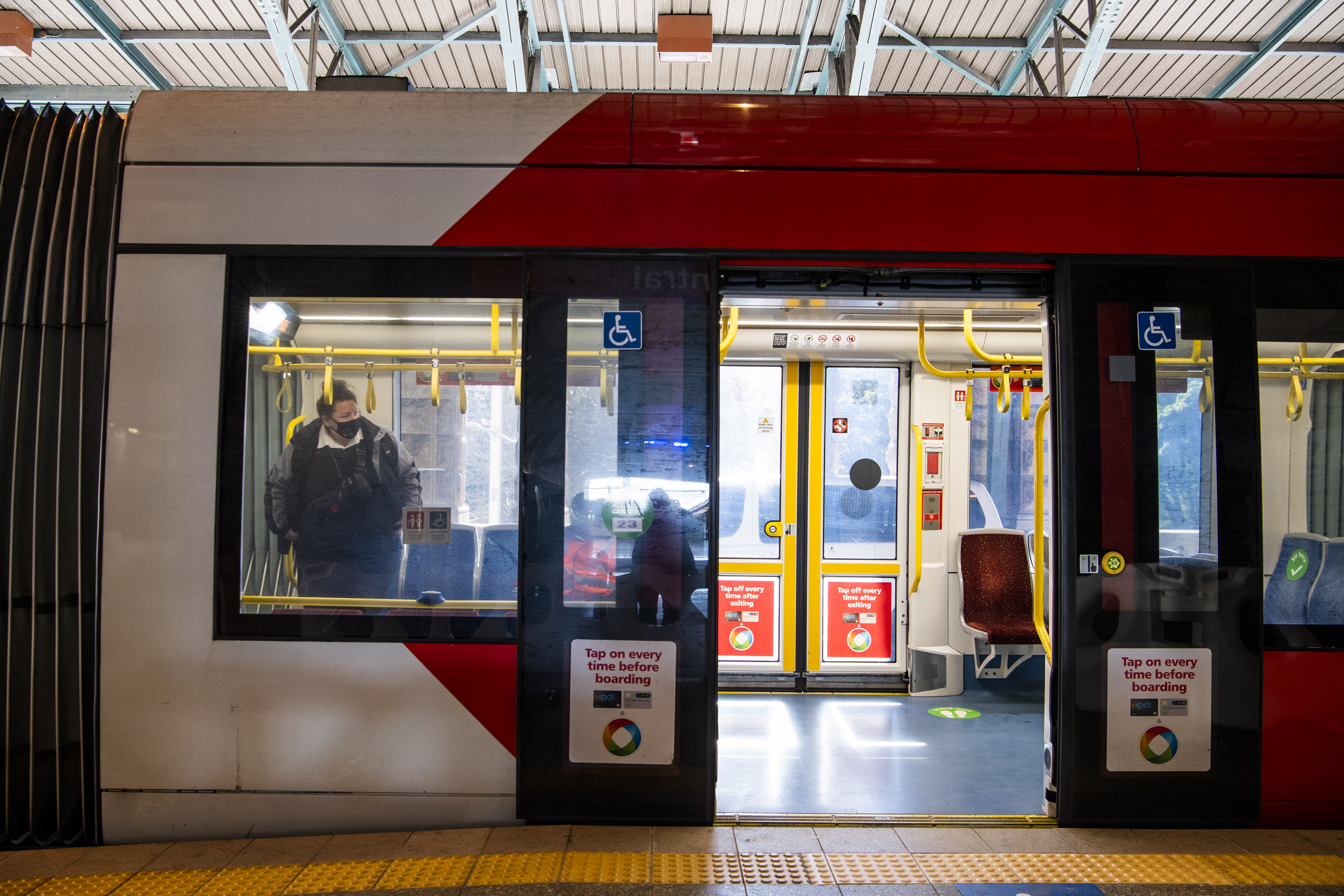 Commuters travelling on the Light rail.  Central Station. Sydney. Generic Public transport. Coronavirus COVID-19. 20th July 2021 Photo Louise Kennerley