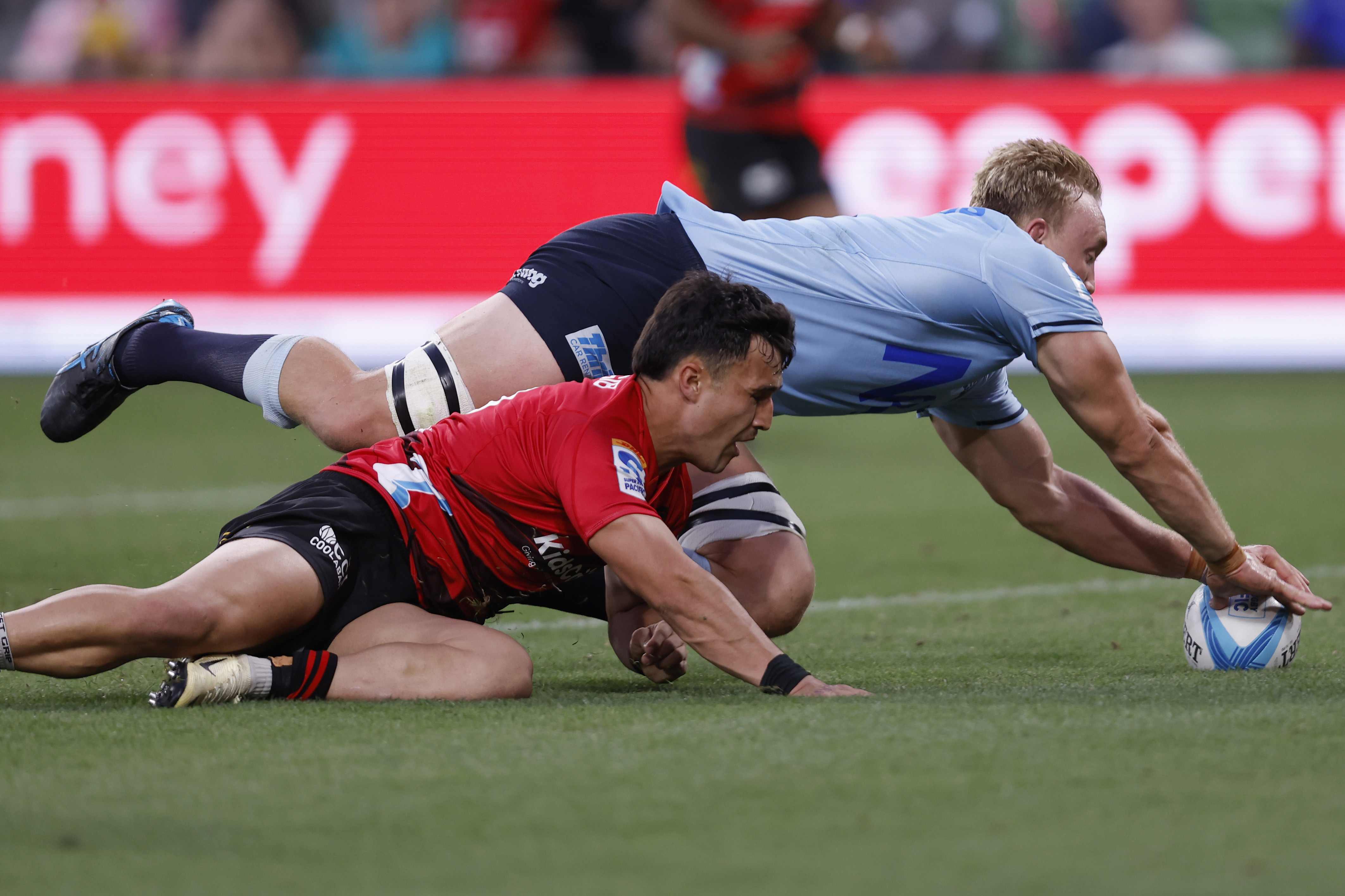 Hugh Sinclair of the Waratahs scores a try during the round two Super Rugby Pacific match against the Crusaders.
