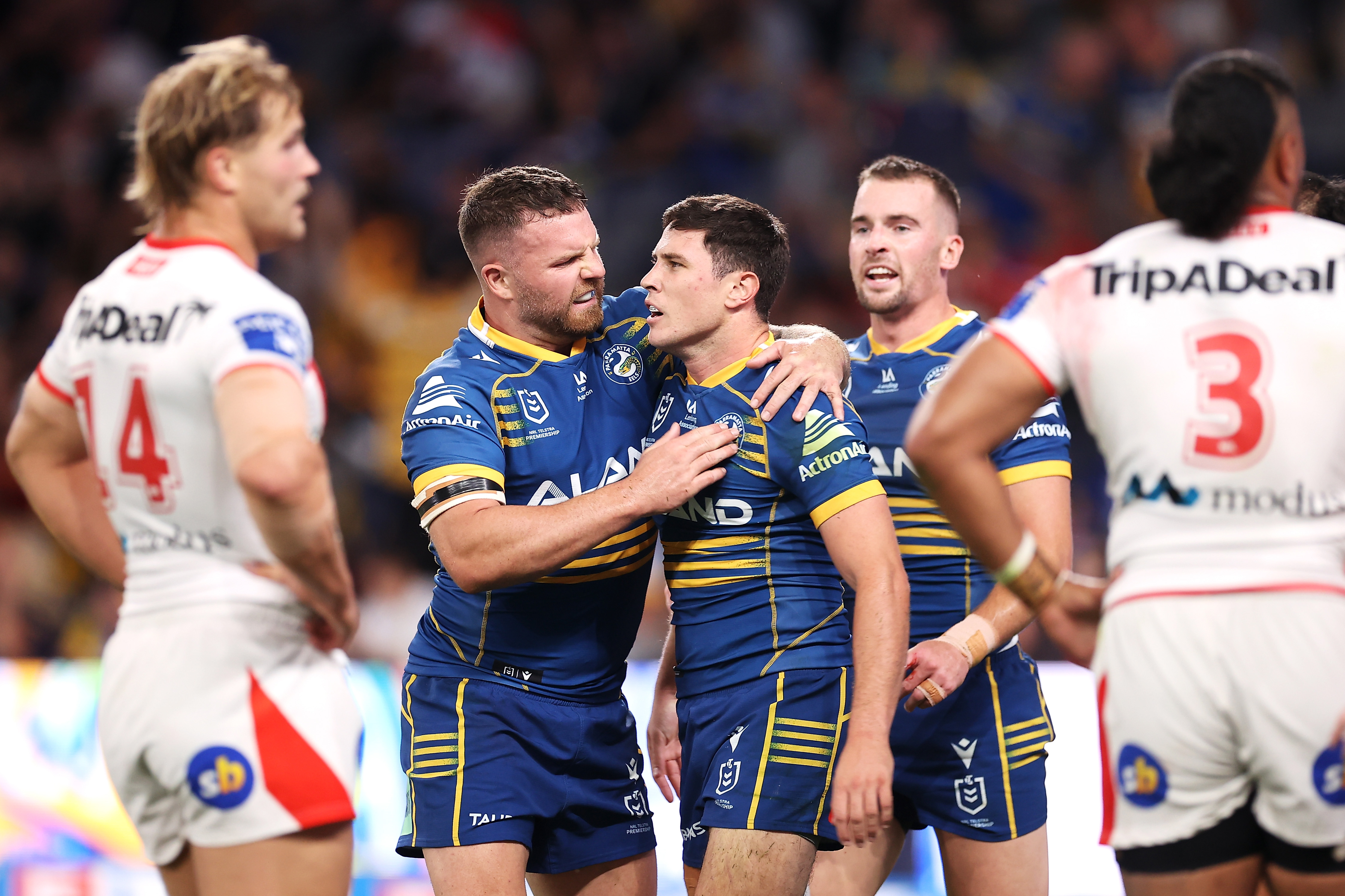 Nathan Brown of the Eels congratulates Mitchell Moses as he celebrates a try.