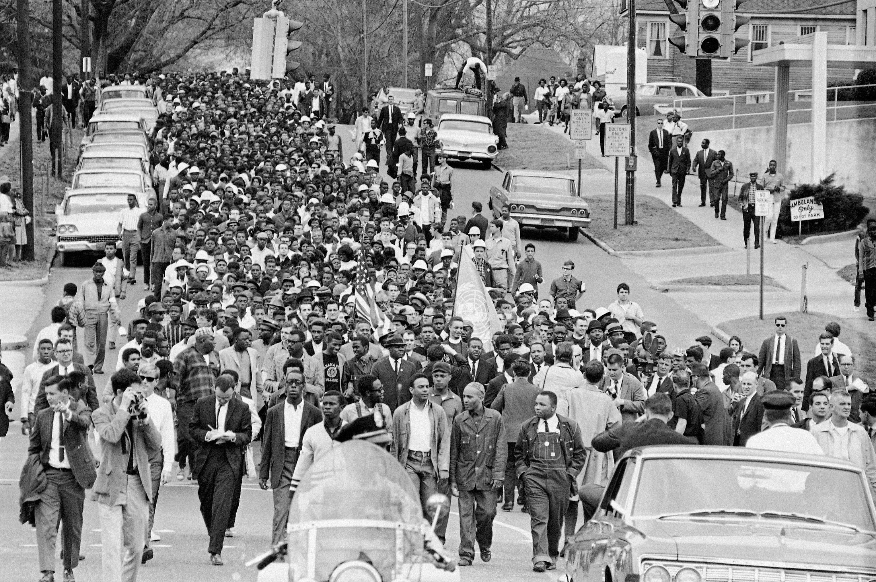 Demonstrators walk to the courthouse behind the Reverend Martin Luther King Jr in Montgomery, Alabama on March 17 in 1965.