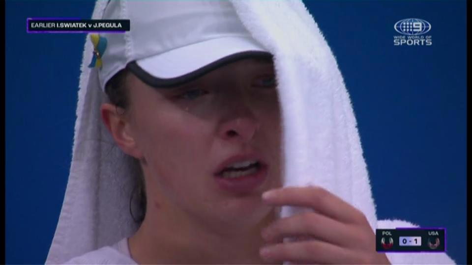 Iga Swiatek hides tears following her United Cup loss to Jessica Pegula.
