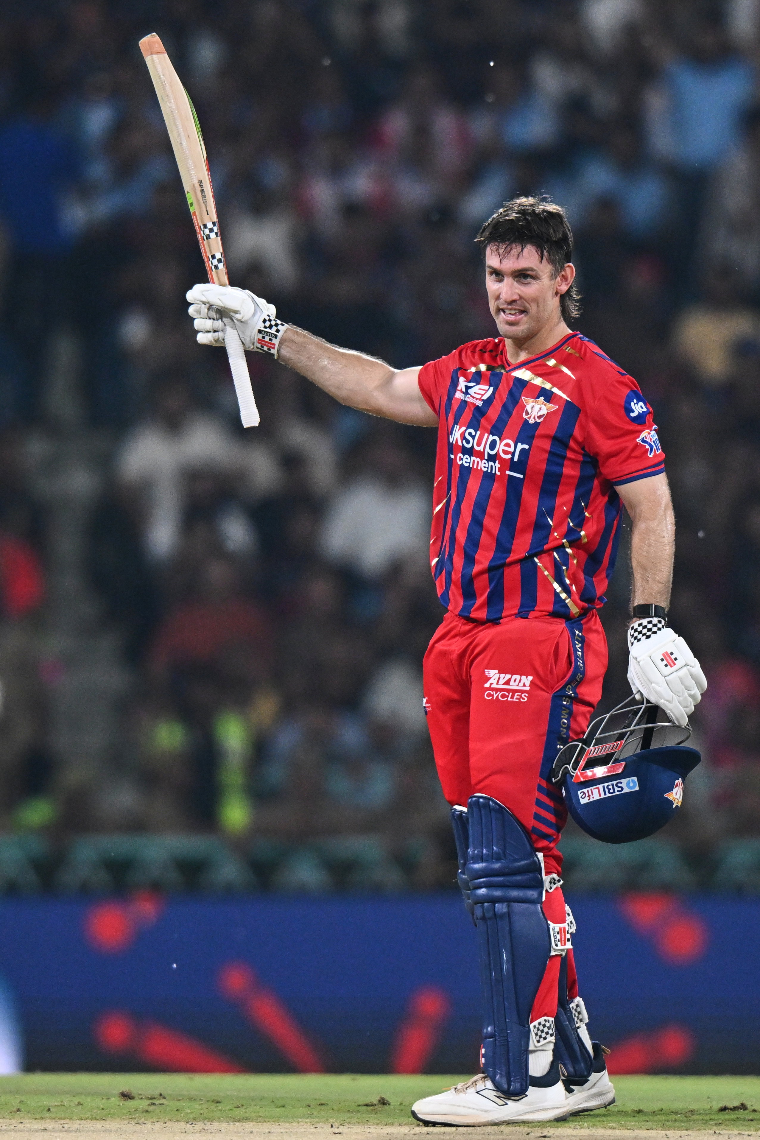 Lucknow Super Giants' Mitchell Marsh celebrates his century during the Indian Premier League cricket match between Royal Challengers Bengaluru and Lucknow Super Giants in Lucknow, India, Thursday, May 7, 2026. (AP Photo)