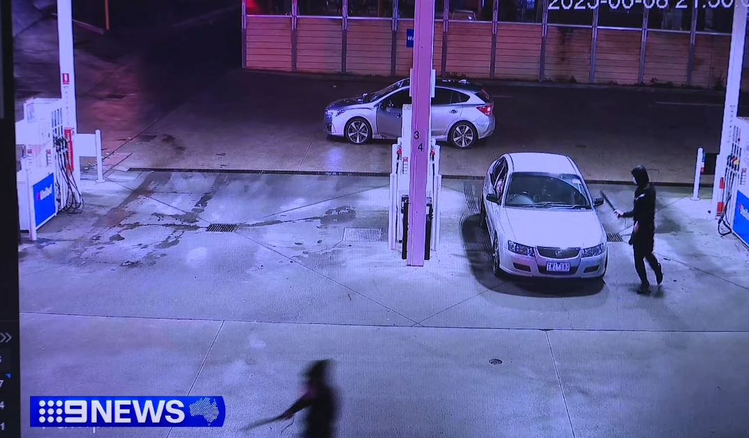 Two males are on the run after a teenager was slashed with a machete ﻿while he was refuelling at a service station in Melbourne.
