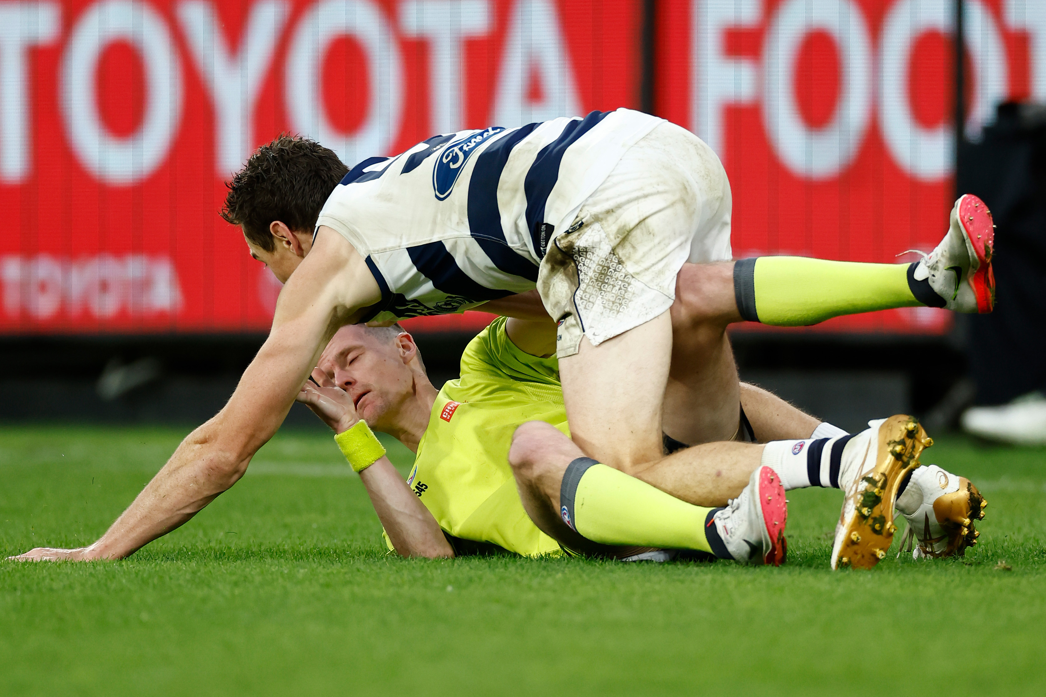 AFL Field Umpire, Alex Whetton throws the ball up during round 15.