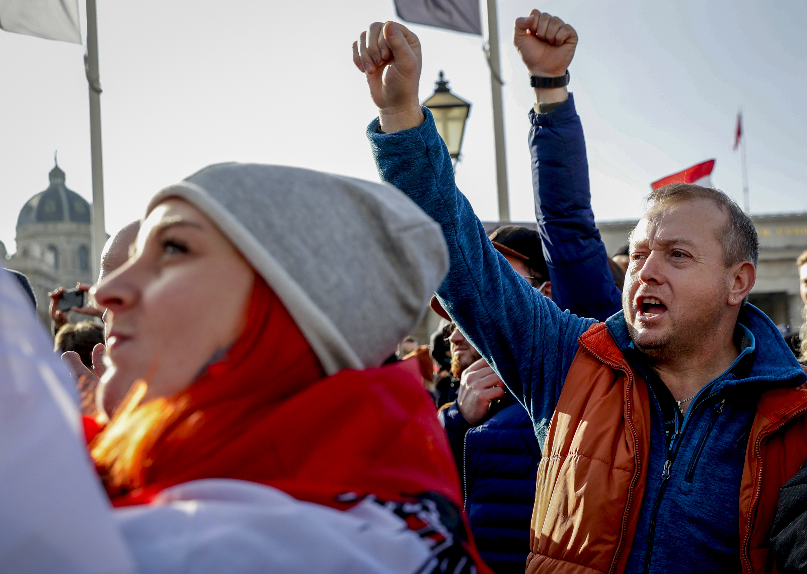 People take part in a demonstration against the country's coronavirus restrictions in Vienna, Austria