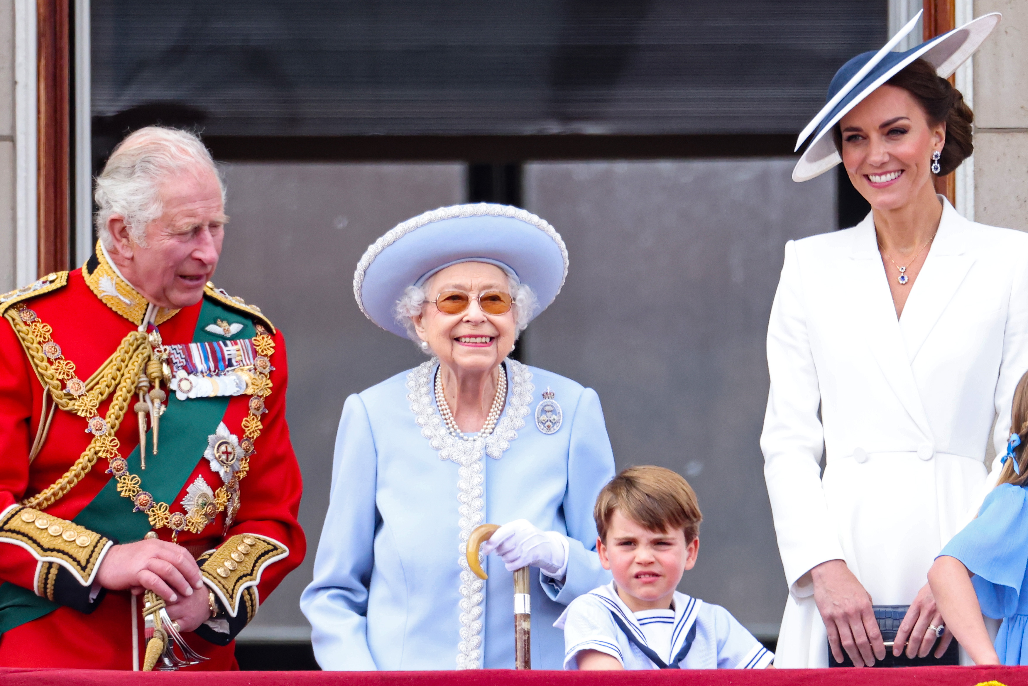 (L-R) Prince Charles, Prince of Wales, Queen Elizabeth II, Prince Louis of Cambridge as Catherine, Duchess of Cambridge and Princess Charlotte of Cambridge on the balcony of Buckingham Palace during the Trooping the Colour parade on June 02, 2022 in London, England. 