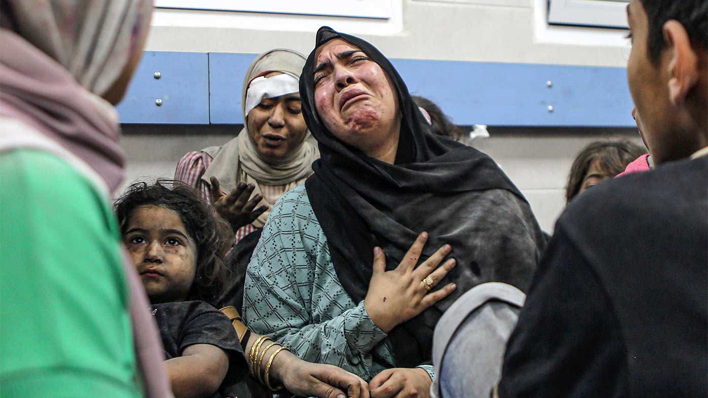 Wounded Palestinians wait for treatment in al-Shifa hospital in Gaza City.