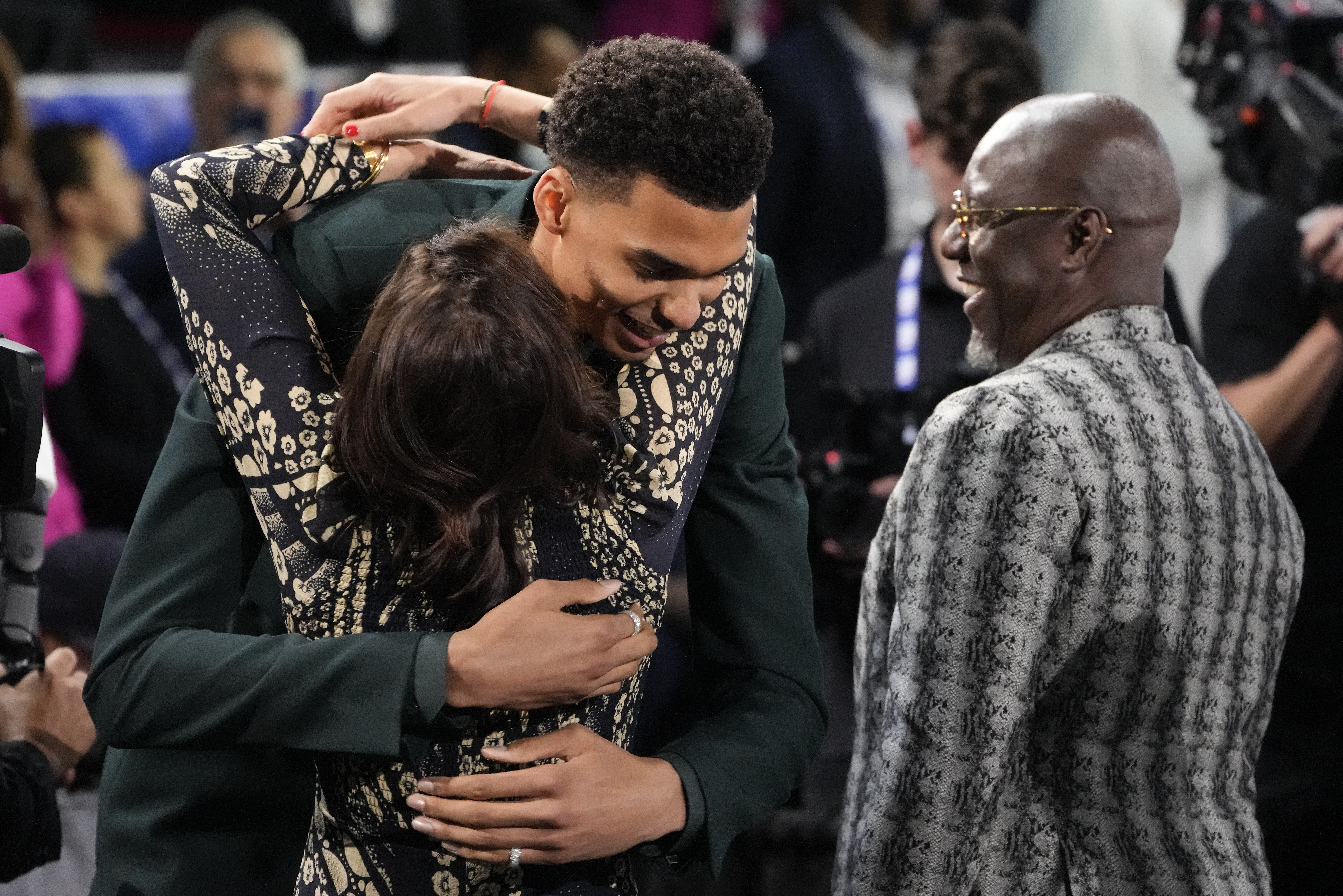 Victor Wembanyama hugs family and friends after being selected first overall by the San Antonio Spurs.