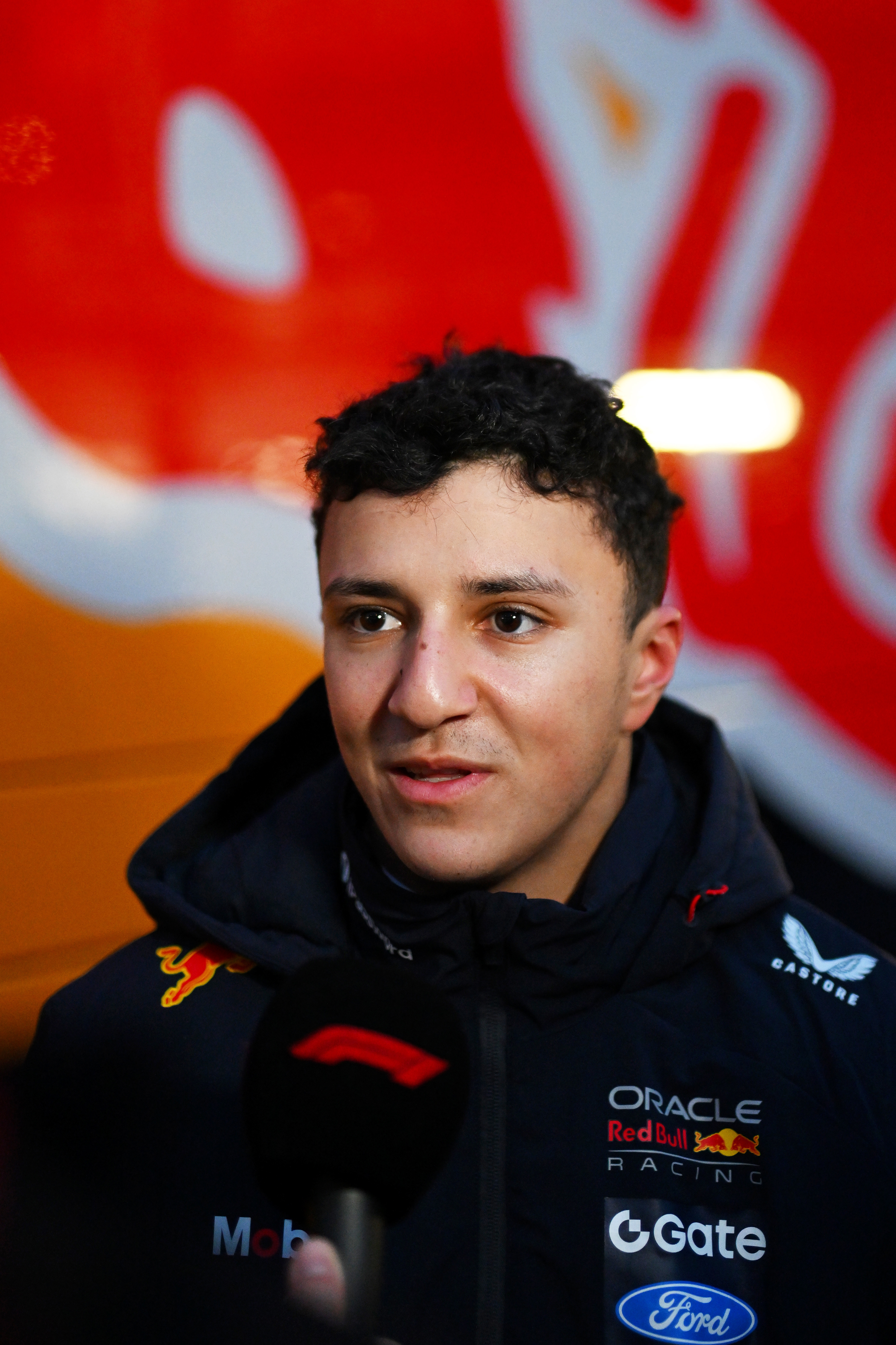 Isack Hadjar of France and Oracle Red Bull Racing is interviewed during day one of F1 Shakedown at Circuit de Catalunya on January 26, 2026 in Montmelo, Spain. (Photo by Rudy Carezzevoli/Getty Images)