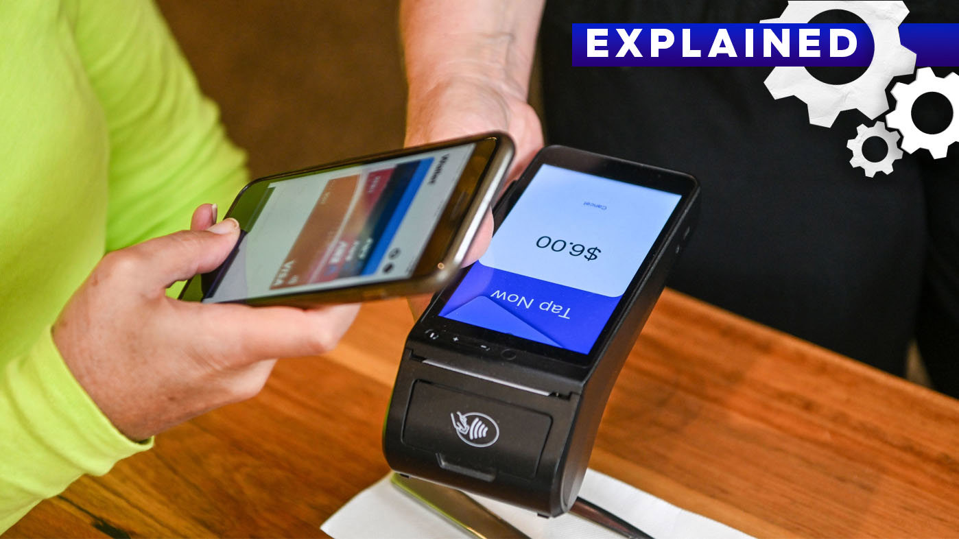 Someone makes a payment using their phone.