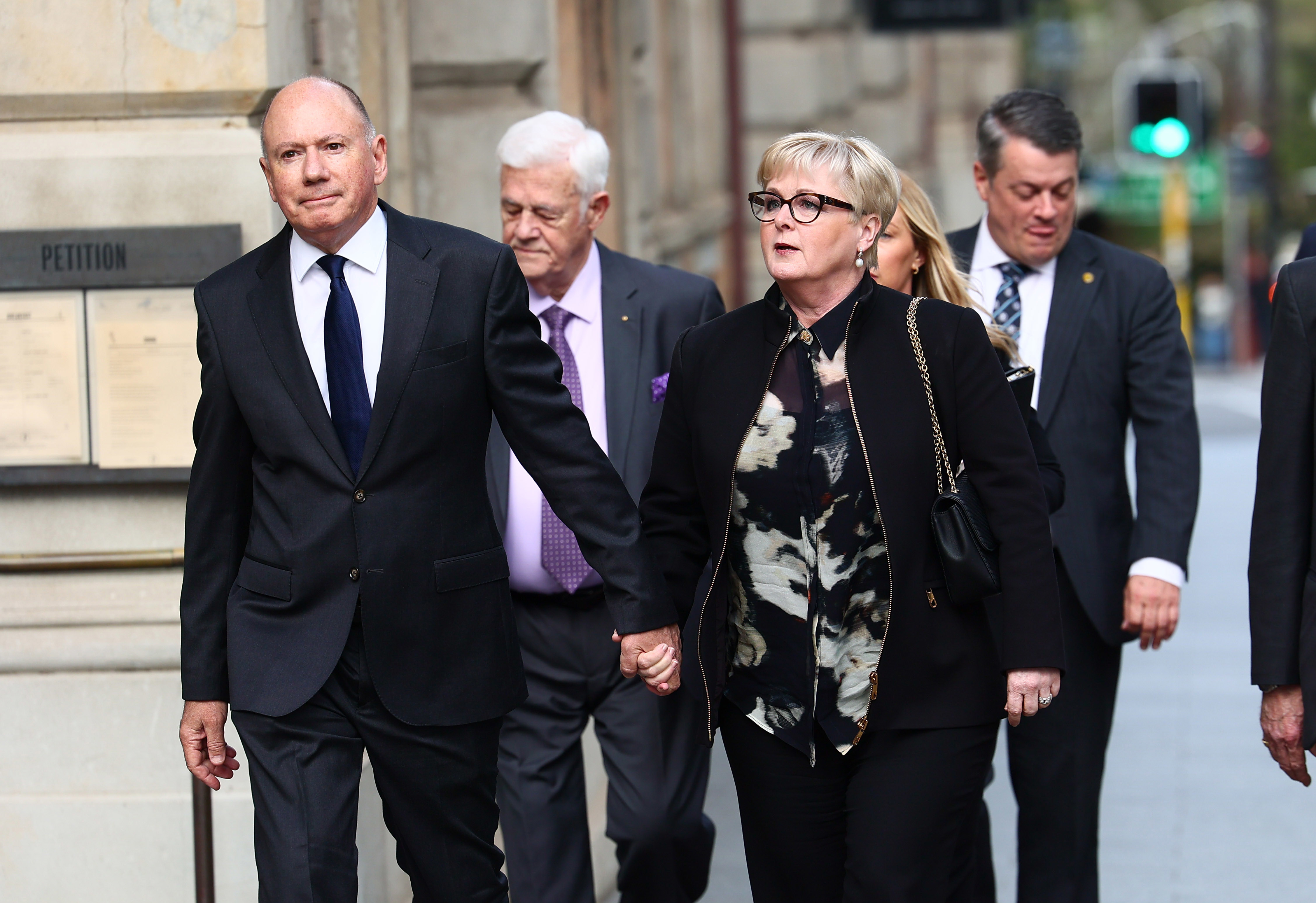 Former Minister Linda Reynolds arrives at the Supreme Court in Perth for the defamation trial, with husband Robert Reid 