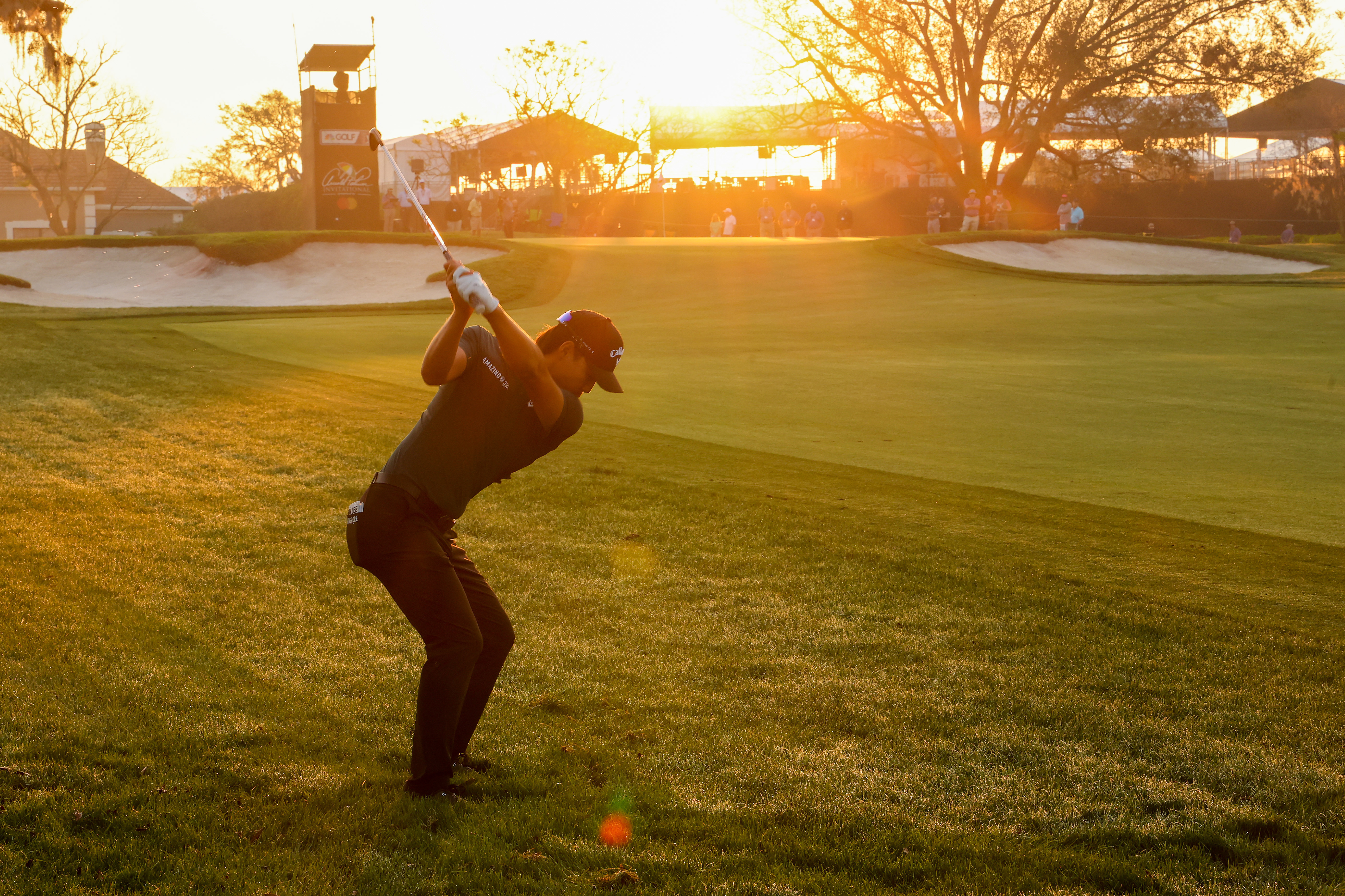 Min Woo Lee of Australia plays an approach shot on the tenth hole during the first round of the Arnold Palmer Invitational presented by Mastercard at Arnold Palmer Bay Hill Golf Course on March 02, 2023 in Orlando, Florida. (Photo by Michael Reaves/Getty Images)
