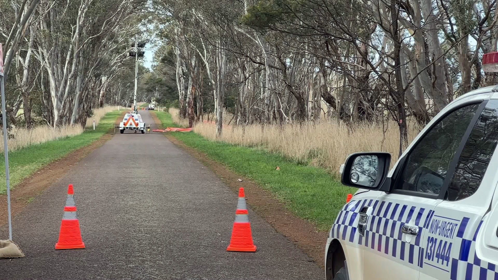 Police officers on the scene after a fatal crash in country Victoria.