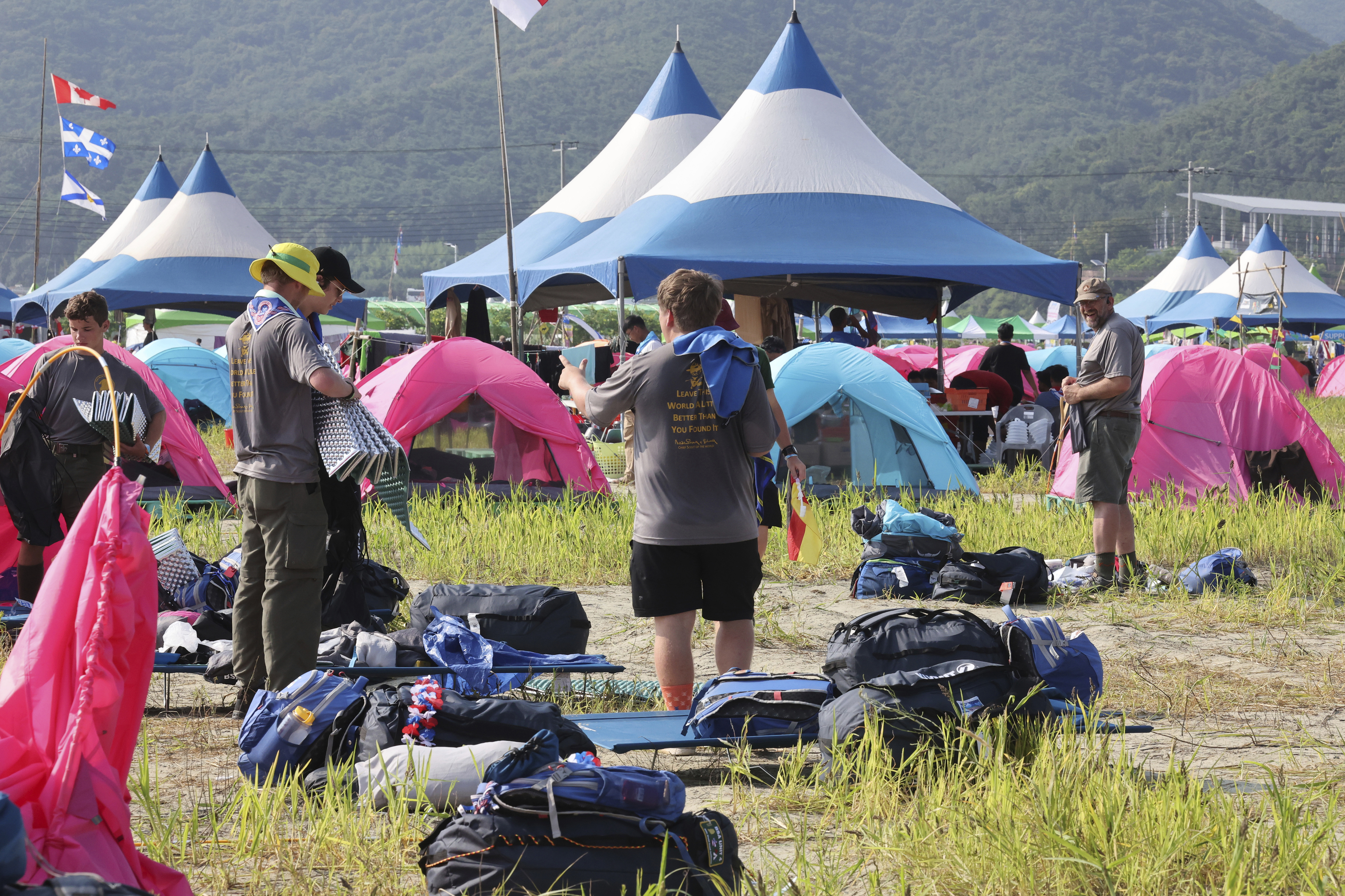 US scout members prepare to leave the World Scout Jamboree campsite in Buan, South Korea, Sunday, Aug. 6, 2023. 