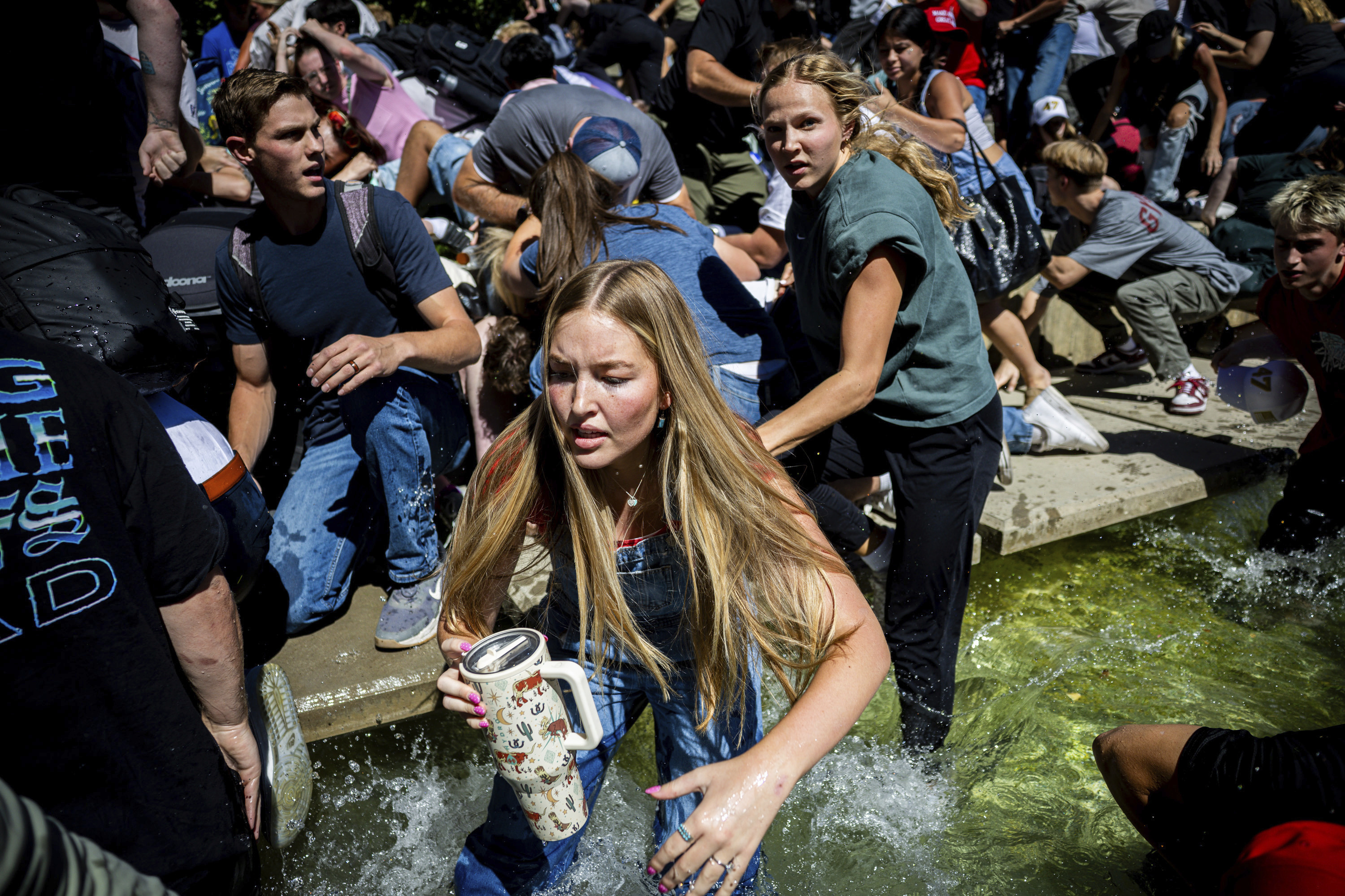 The crowd reacts after Charlie Kirk is shot during Turning Point's visit to Utah Valley University in Orem on Wednesday, Sept. 10, 2025. (Tess Crowley/The Deseret News via AP)