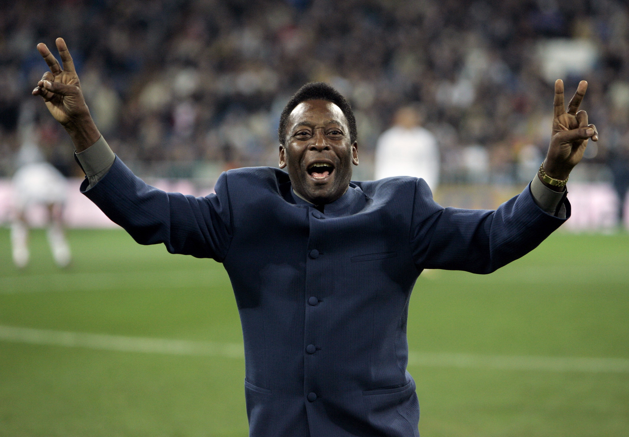Brazil's soccer legend Pele greets the crowd ahead of a Spanish league soccer match, in the Santiago Bernabeu stadium in Madrid, Jan. 16, 2005.