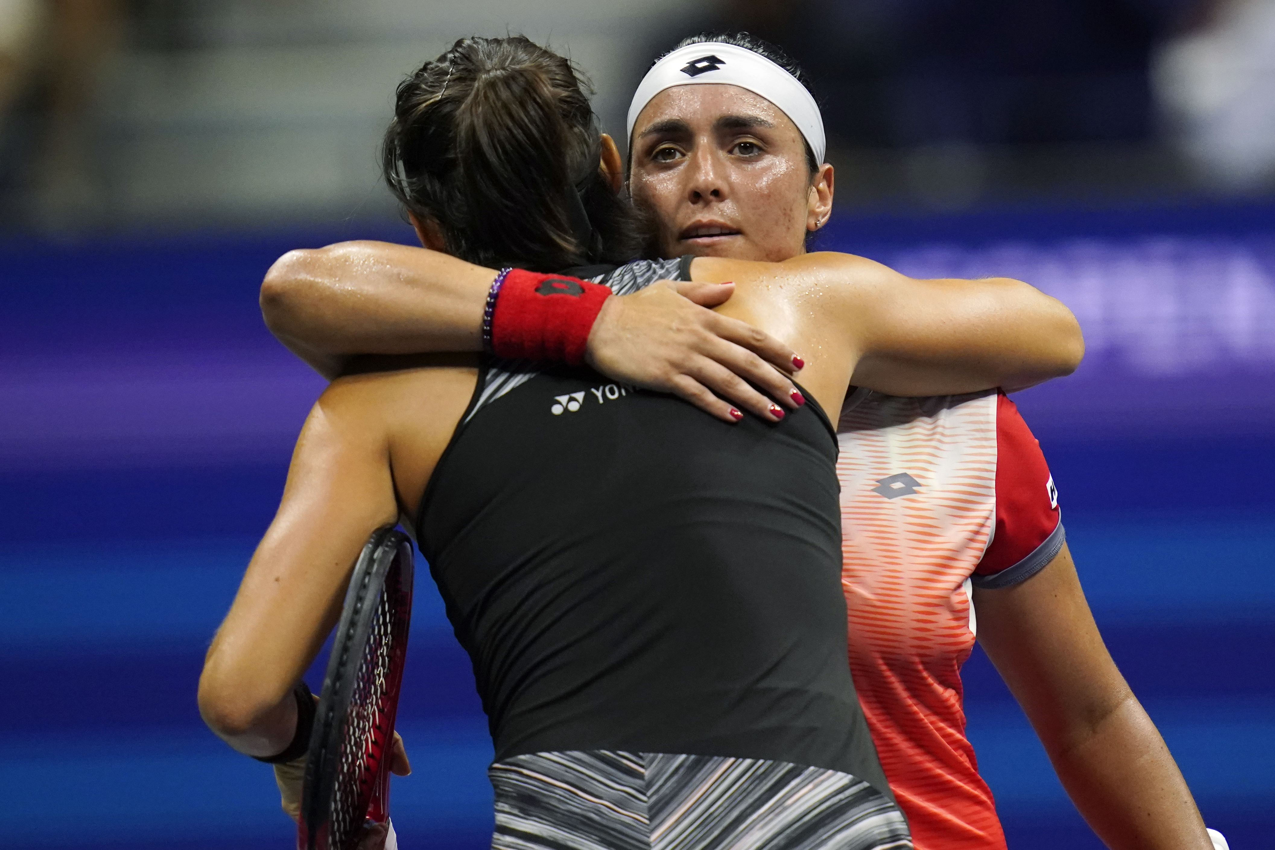 Ons Jabeur, of Tunisia, right, embraces Caroline Garcia, of France, after defeating her in the semifinals of the U.S. Open tennis championships on Thursday, Sept. 8, 2022, in New York. (AP Photo/Charles Krupa)