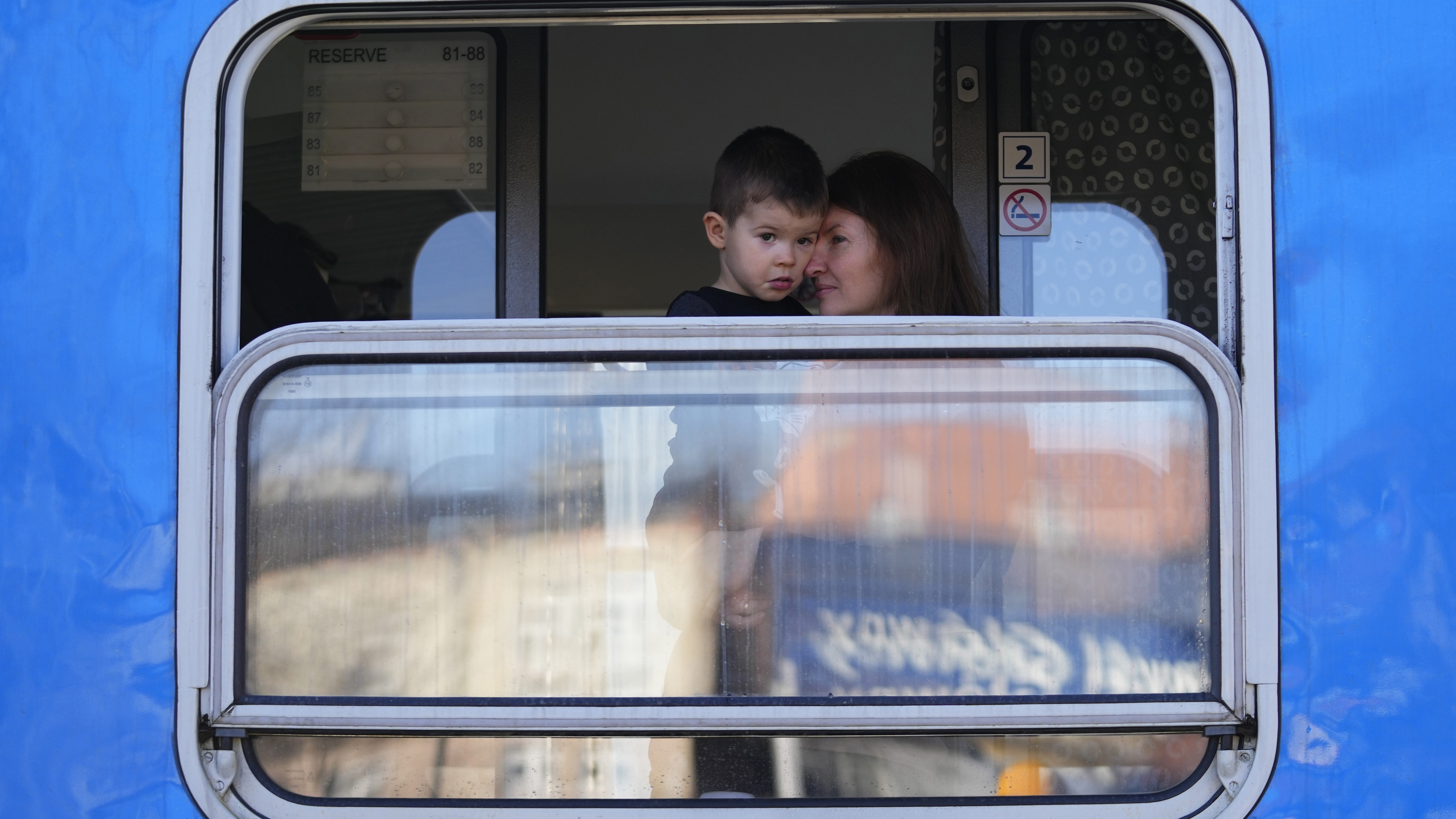 Refuges fleeing the conflict from neighbouring Ukraine wait for their departure to Prague at the Przemysl train station in Przemysl, Poland.