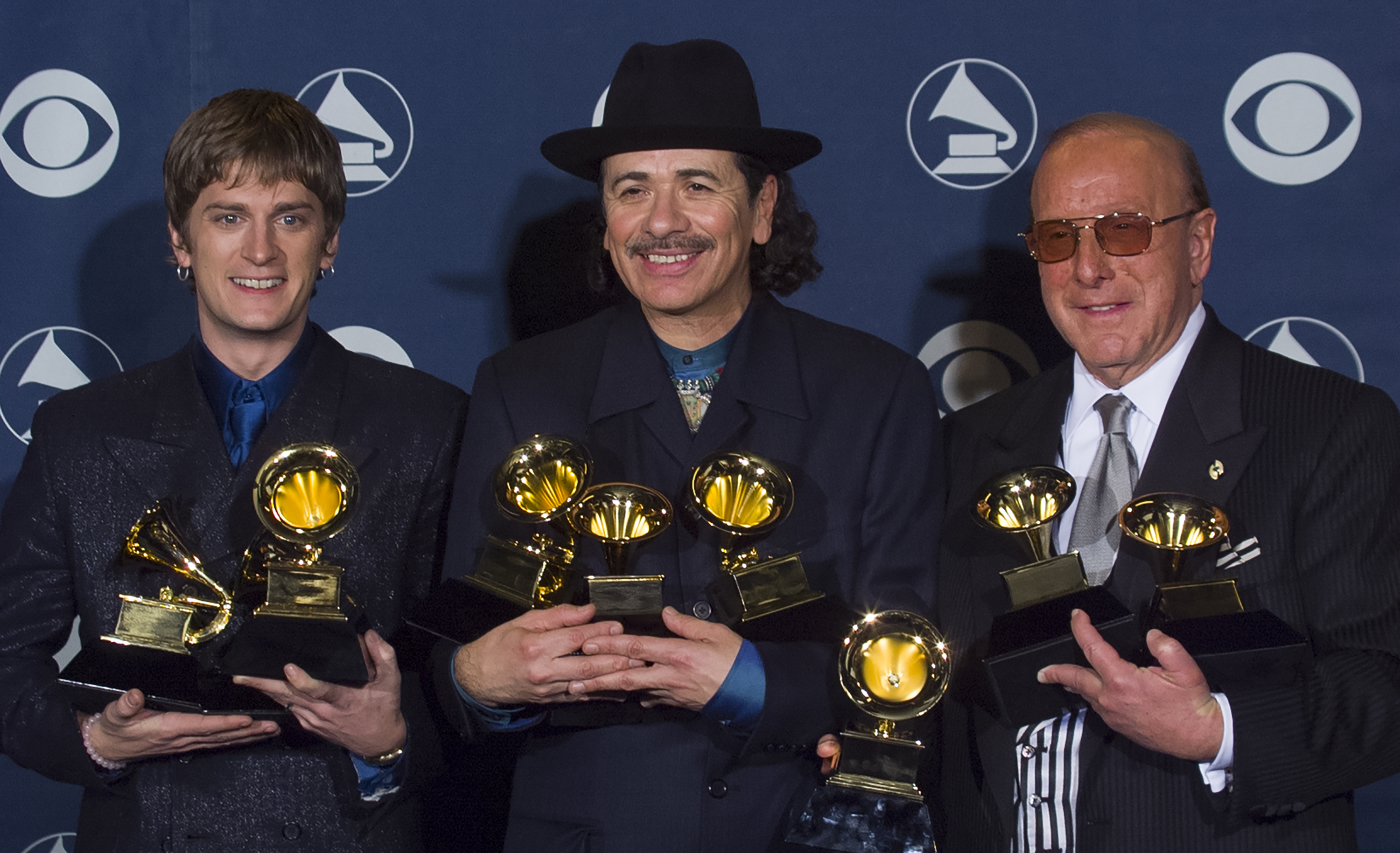 Carlos Santana, Rob Thomas and Clive Davis backstage at the Grammy Awards Show, February 23, 2000 in Los Angeles, California. 