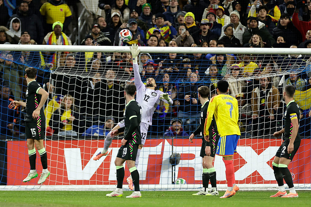 Paul Izzo of Australia makes a save.