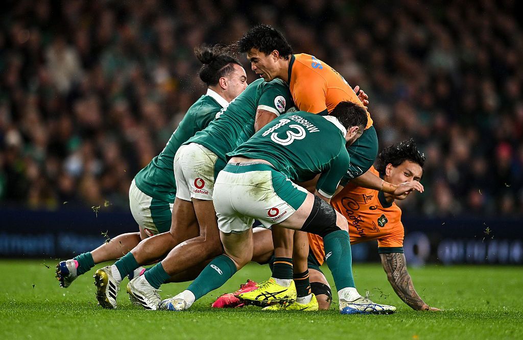 Joseph-Aukuso Suaalii of Australia is tackled by Ireland.