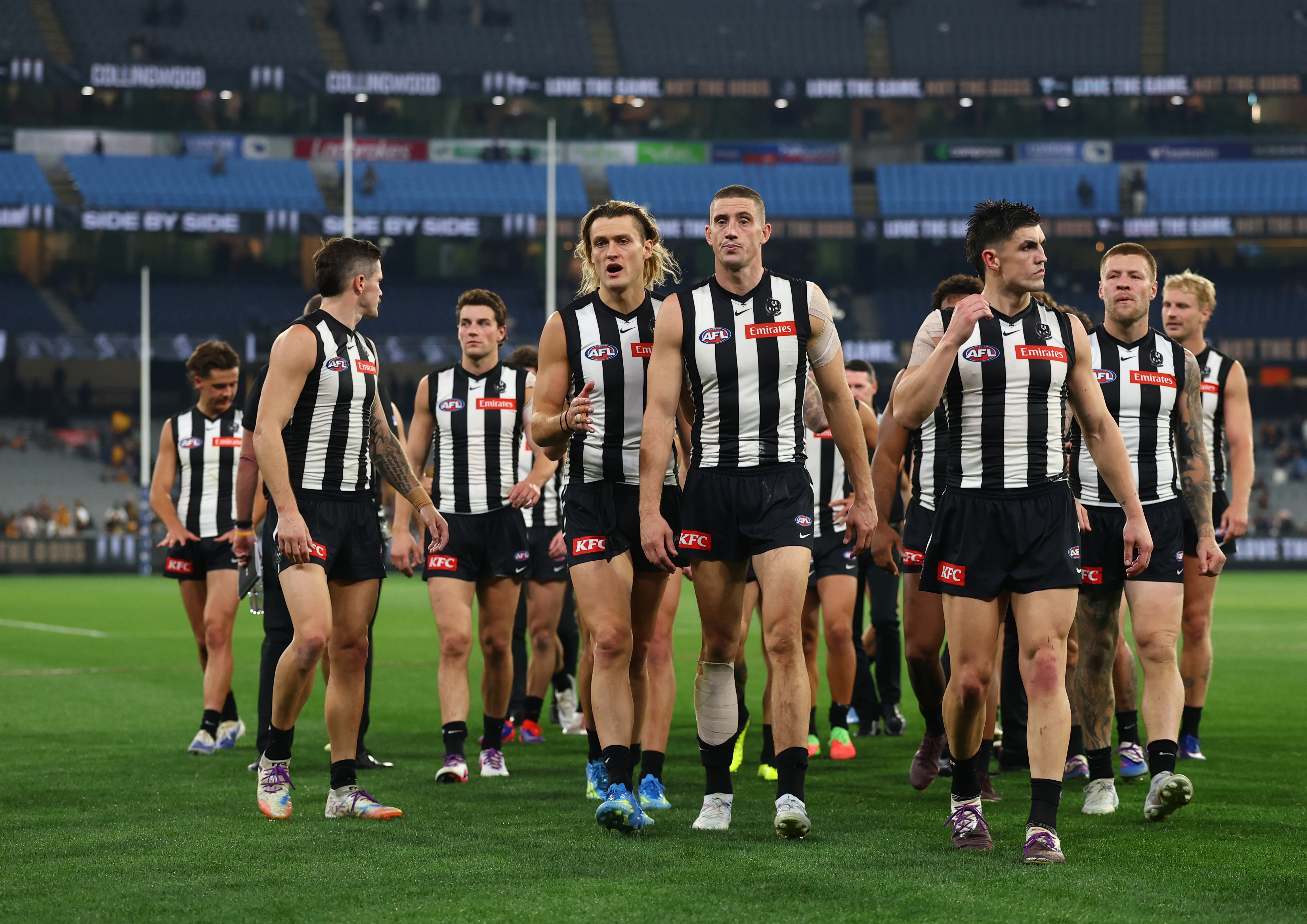 MELBOURNE, AUSTRALIA - APRIL 30: The Magpies walk off after the match ended in a draw during the round eight AFL match between Collingwood Magpies and Hawthorn Hawks at Melbourne Cricket Ground, on April 30, 2026, in Melbourne, Australia. (Photo by Robert Cianflone/Getty Images)
