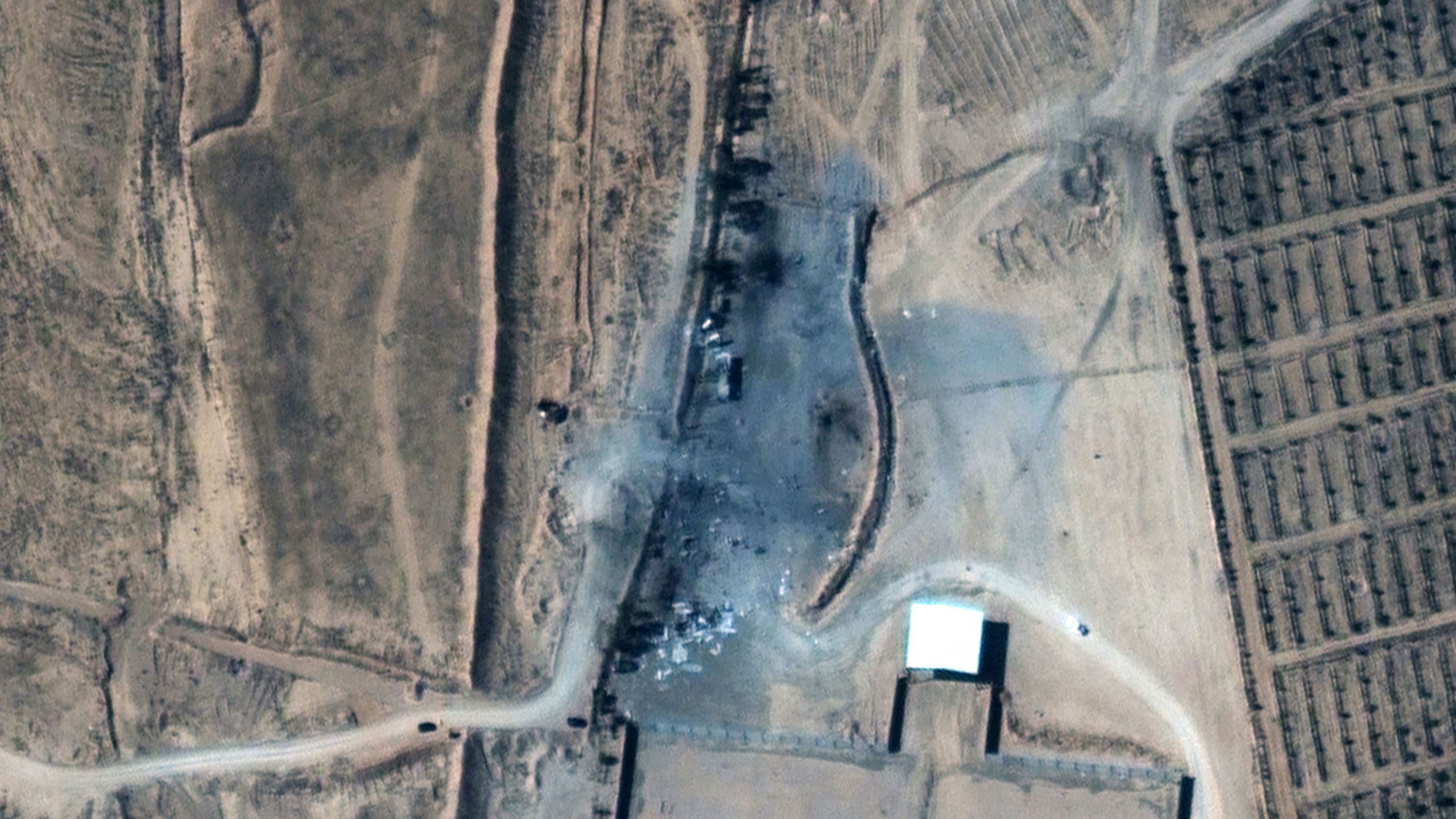 This satellite image after the deployment shows buildings destroyed.