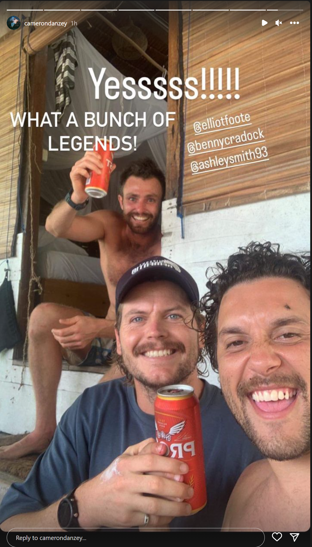 Elliot Foote enjoying a bear with two friends to celebrate his survival after disappearing in the Indonesian ocean.