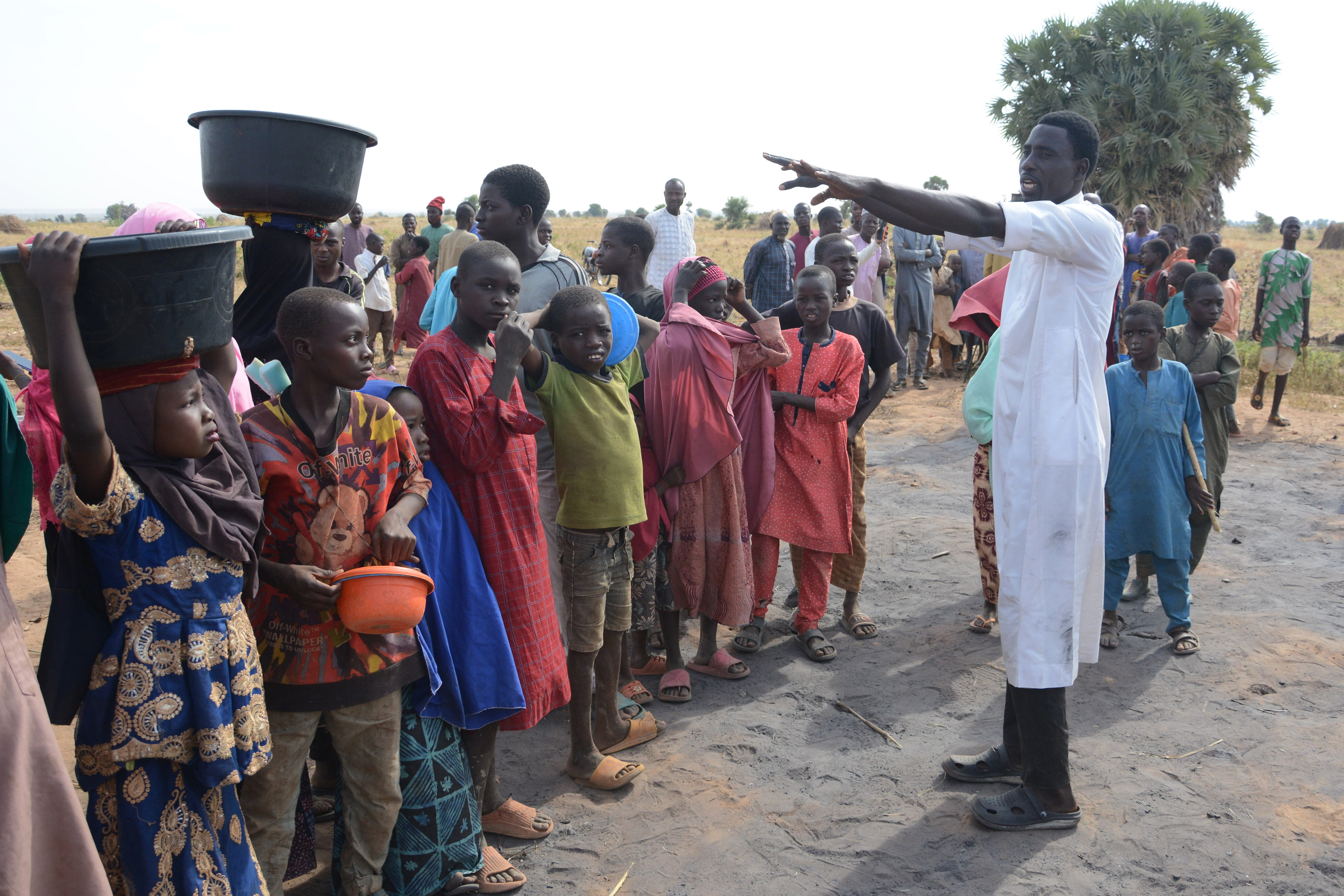 People visit the site of a U.S. airstrike in Northwest, Jabo, Nigeria, Friday, Dec. 26, 2025. (AP Photo/ Tunde Omolehin)