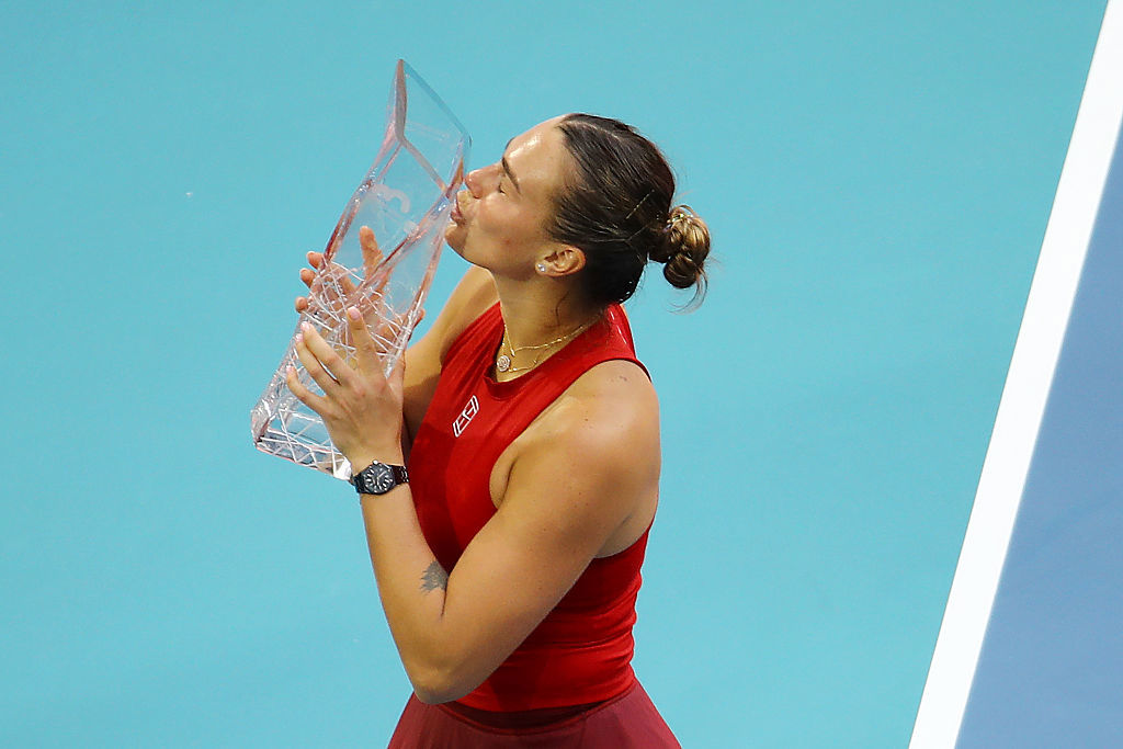 Aryna Sabalenka poses with the Butch Buchholz Trophy.