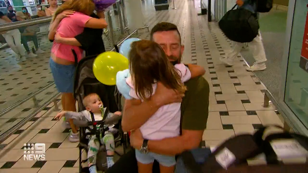 Jason Marrable returned to Brisbane airport with his family in toe after a week rescue mission in Ukraine. 