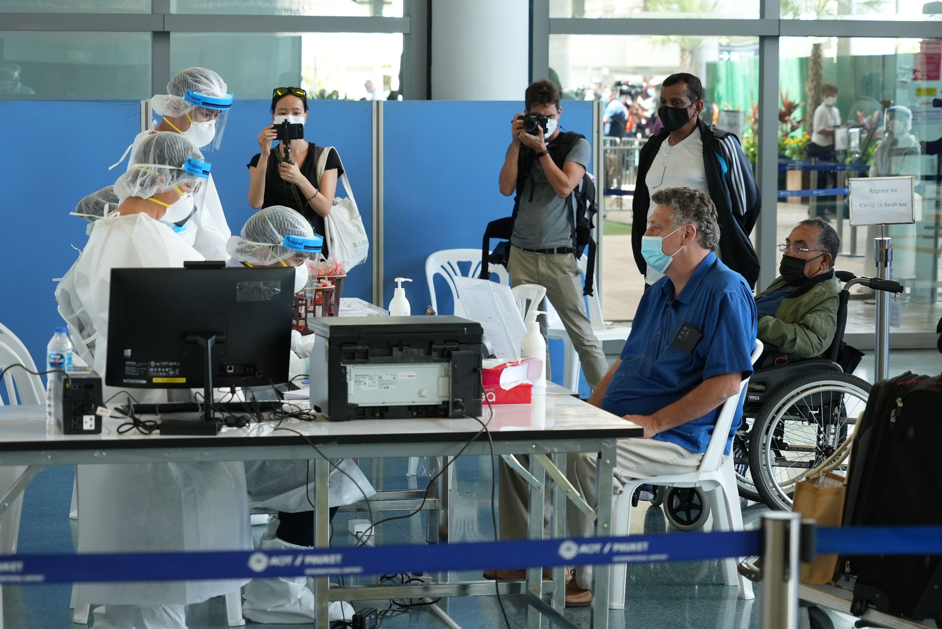 International travellers flying into Phuket must go through a series of screening checkpoints.