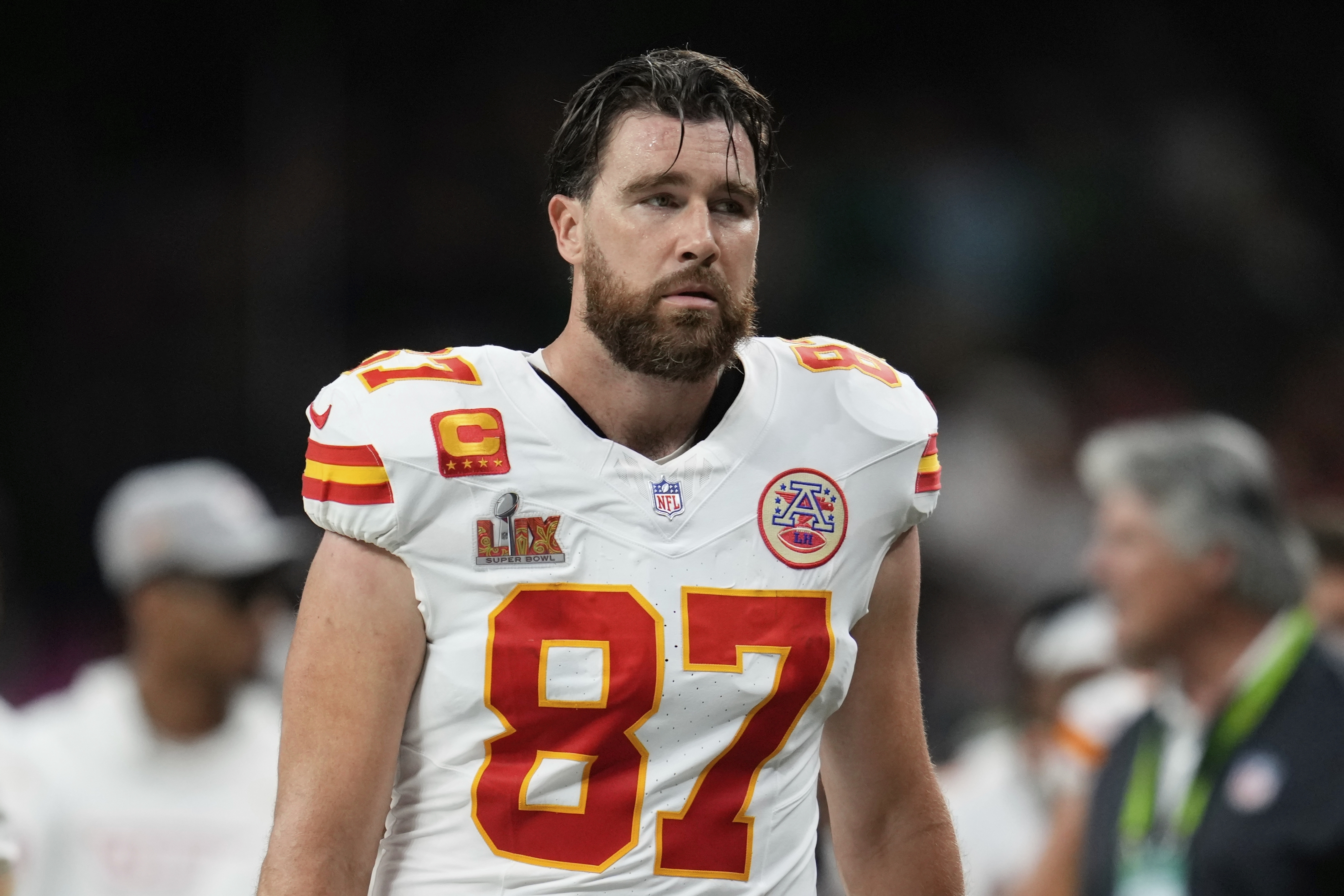 A dejected Kansas City Chiefs tight end Travis Kelce (87) walks off the field at the halftime break during the NFL Super Bowl 59 football game against the Philadelphia Eagles, Sunday, Feb. 9, 2025, in New Orleans. (AP Photo/Abbie Parr)
