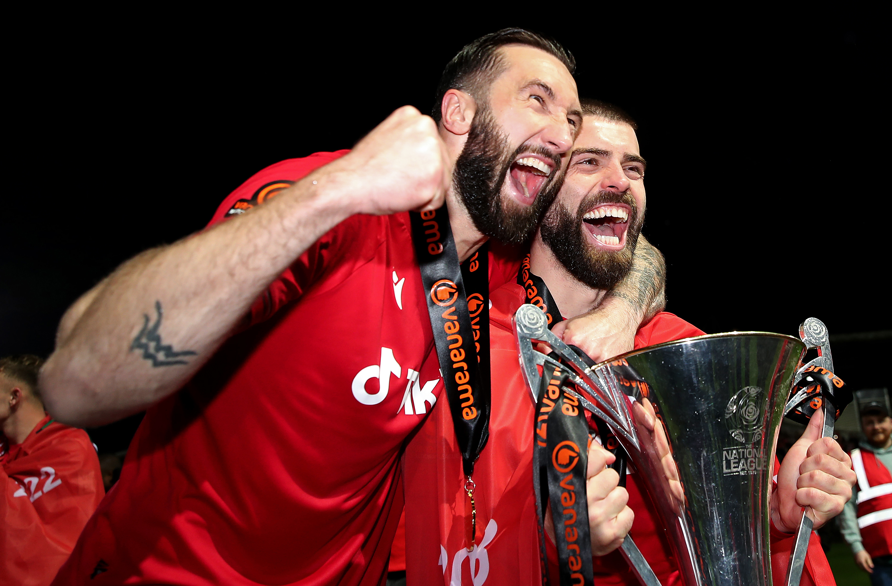 Ollie Palmer and Elliot Lee of Wrexham celebrate with the Vanarama National League trophy as Wrexham win the Vanarama National League and are promoted to the English Football League after victory in the Vanarama National League match between Wrexham and Boreham Wood at Racecourse Ground on April 22, 2023 in Wrexham, Wales. (Photo by Jan Kruger/Getty Images)