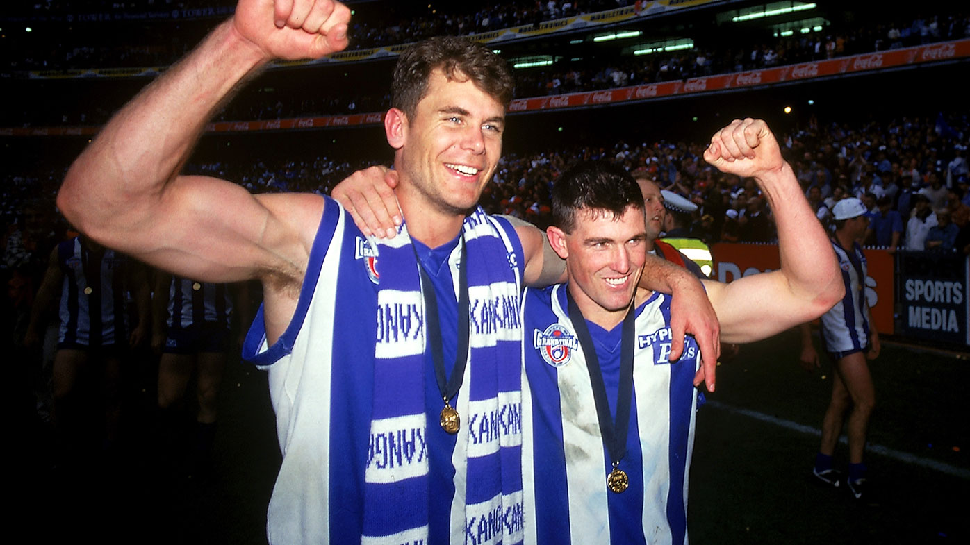  1996: (L-R) Wayne Carey and Anthony Stevens of the Kangaroos celebrate victory after the AFL Grand Final match between the North Melbourne Kangaroos and the Sydney Swans at the Melbourne Cricket Ground 1996, in Melbourne, Australia. (Photo by Getty Images)