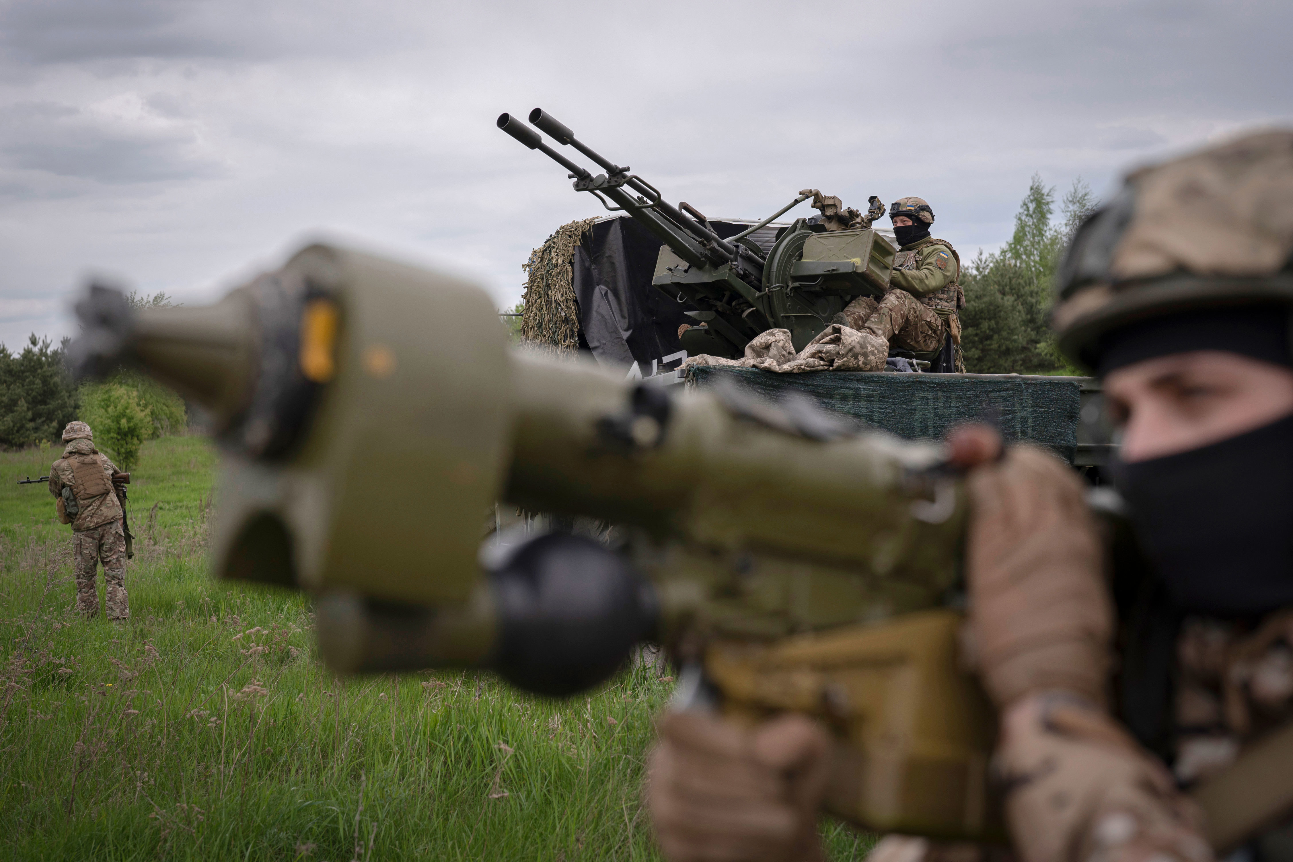 Members of a Ukrainian air-defence unit take up a position near Kyiv.