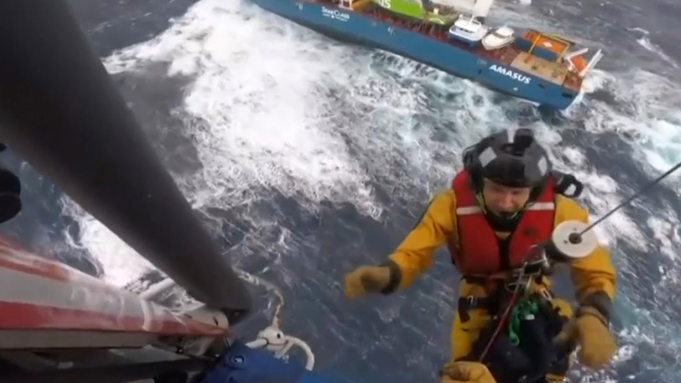 Some of the 12 crew members jumped into the ocean from the badly listing Eemslift Hendrika before being rescued by helicopter. Others were hoisted directly from the deck.