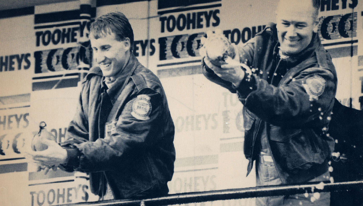 Mark Skaife and Jim Richards on the podium after their 1992 Bathurst 1000 victory.