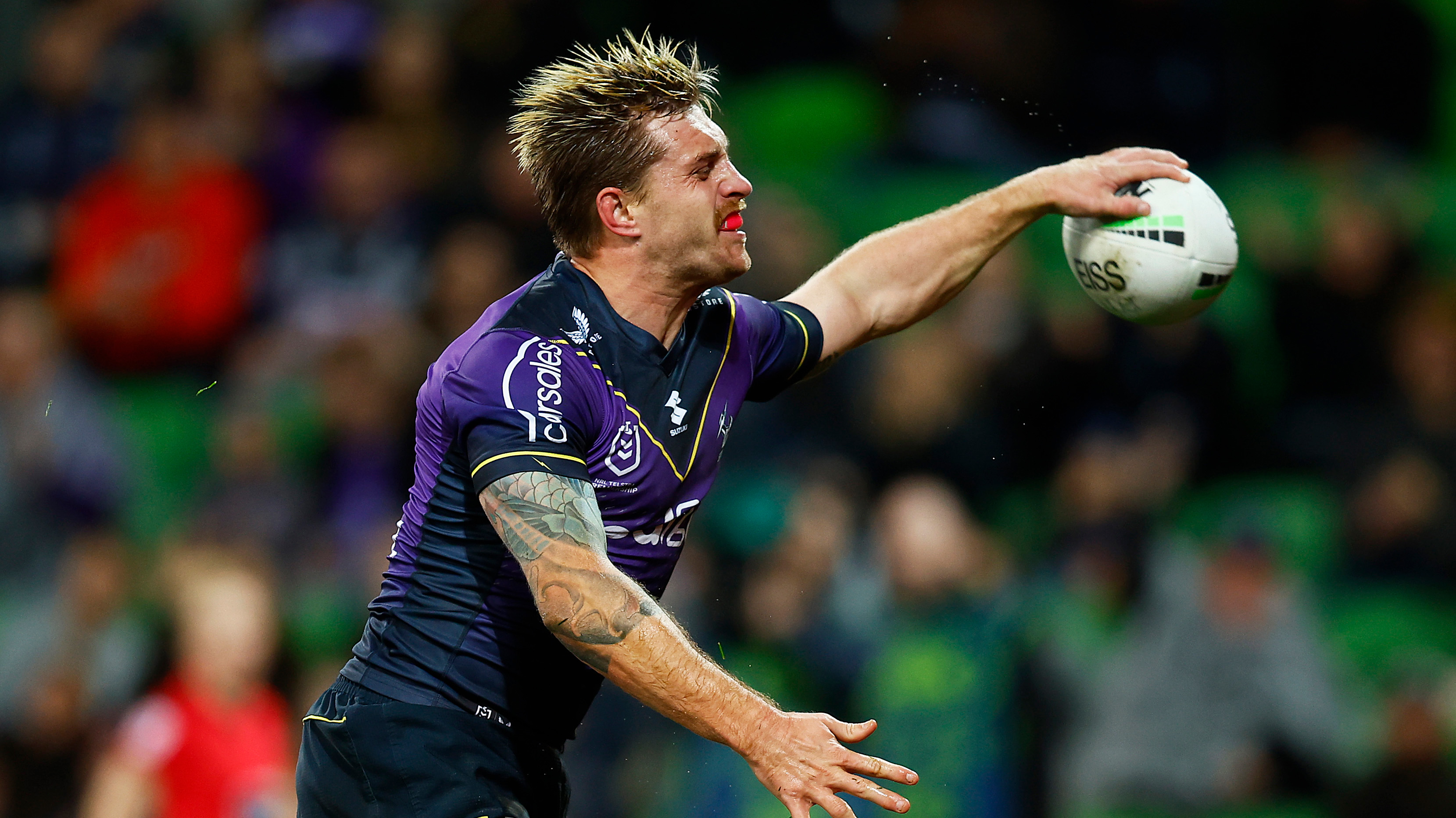 Cameron Munster of the Storm celebrates scoring a try during the round 21 NRL match between the Melbourne Storm and the Gold Coast Titans at AAMI Park, on August 05, 2022, in Melbourne, Australia. (Photo by Daniel Pockett/Getty Images)