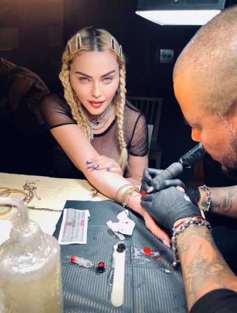 Madonna and son David get matching tattoos.
