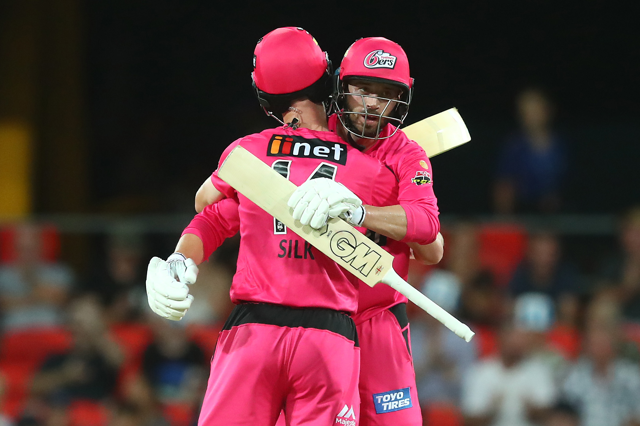 Jordan Silk and James Vince of the Sixers celebrate winning the Big Bash League match.