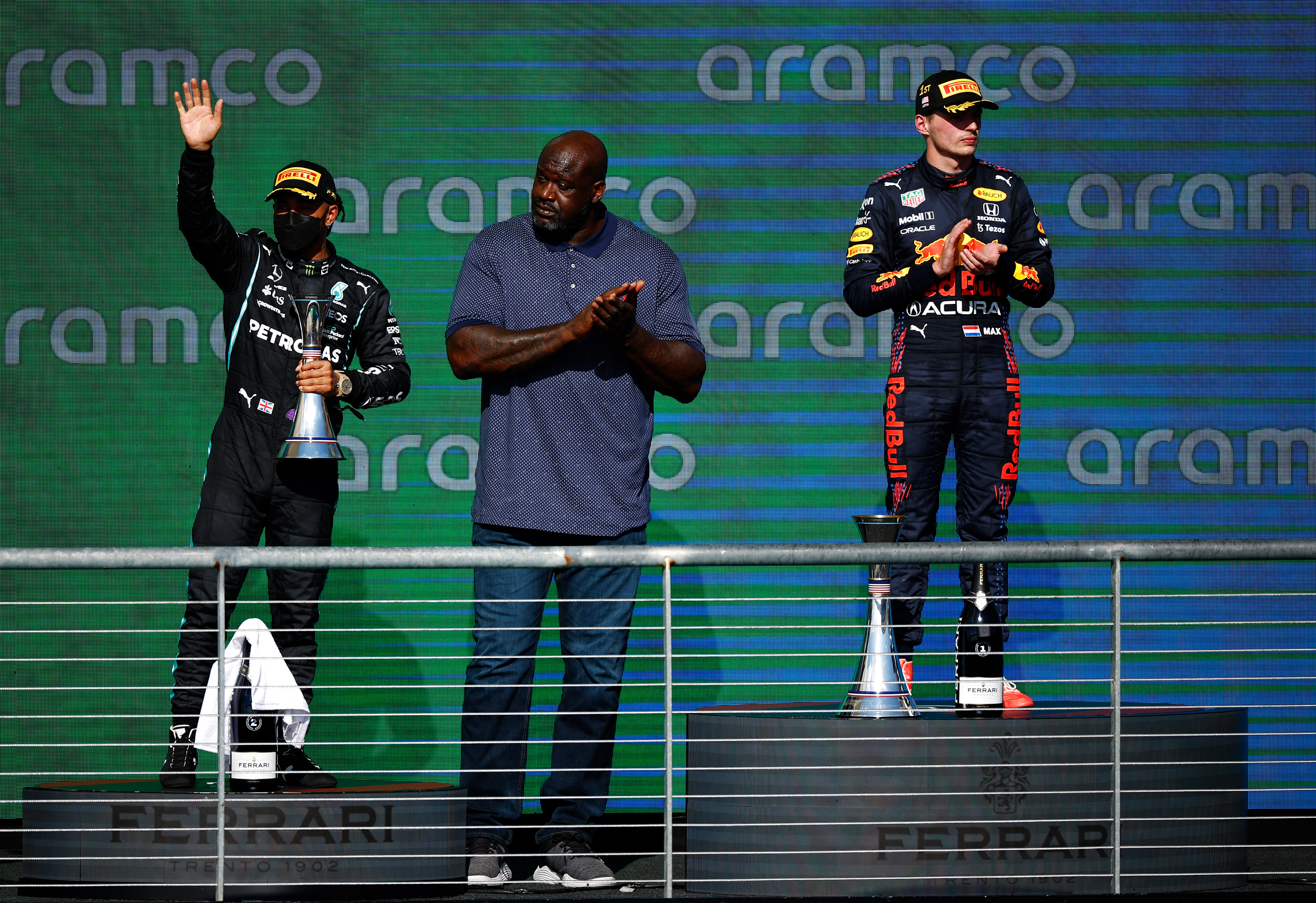 NBA legend Shaquille O'Neal on the podium with Lewis Hamilton (left) and Max Verstappen at the US Grand Prix.